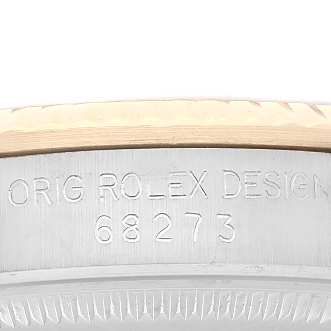 The image shows a close-up of the engraved case of a Mid-Size Rolex watch, highlighting the model number 68273.