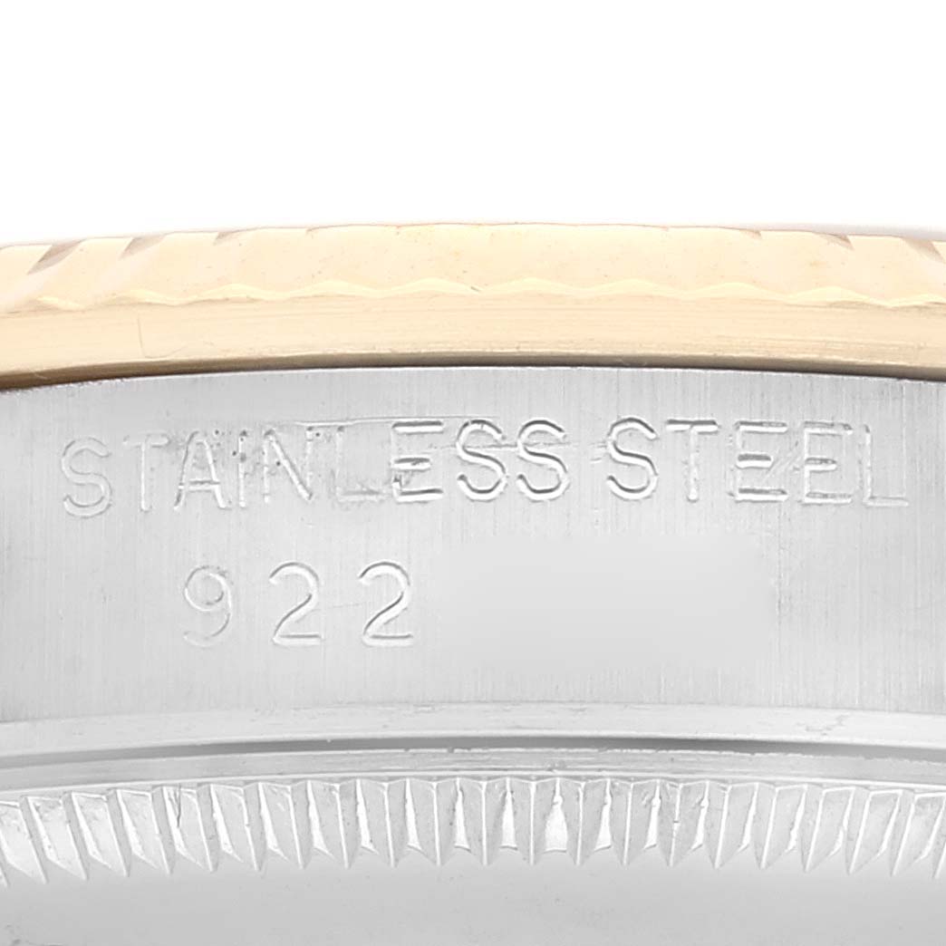 This close-up image shows the side of a mid-size Rolex watch case, highlighting the stainless steel marking and the model number.