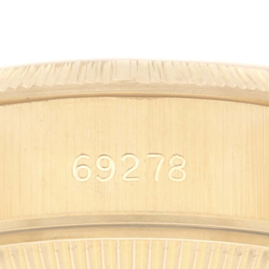 This image shows a close-up angle of the Rolex President 69278 Women
s Yellow Gold Champagne Dial 69278 Women
s Yellow Gold Champagne Dial watch case, specifically highlighting the engraved model number "69278".