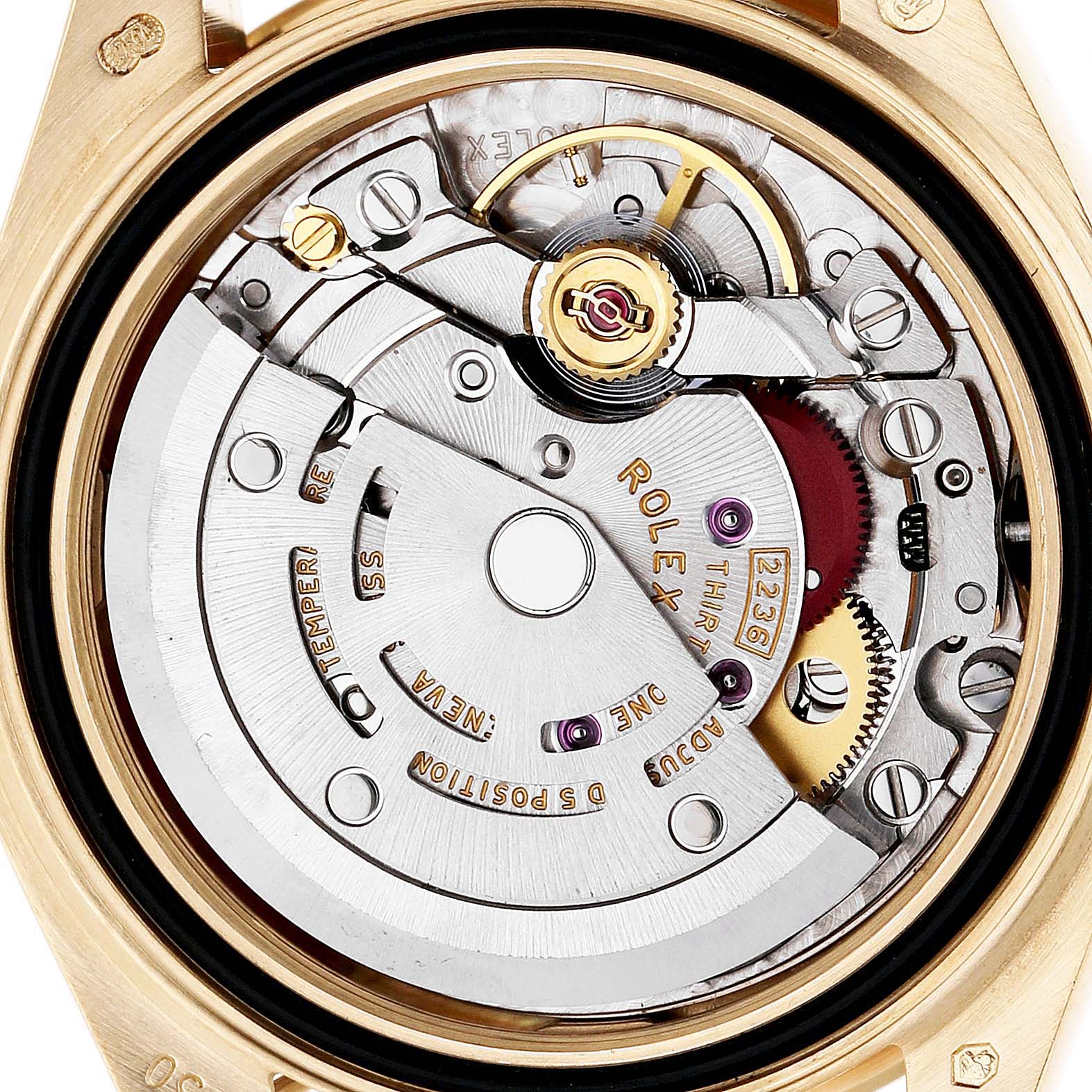 The image shows the Rolex Datejust 279138 Women's Yellow Gold Green Dial movement from a top-down angle, highlighting the rotor and intricate internal components.