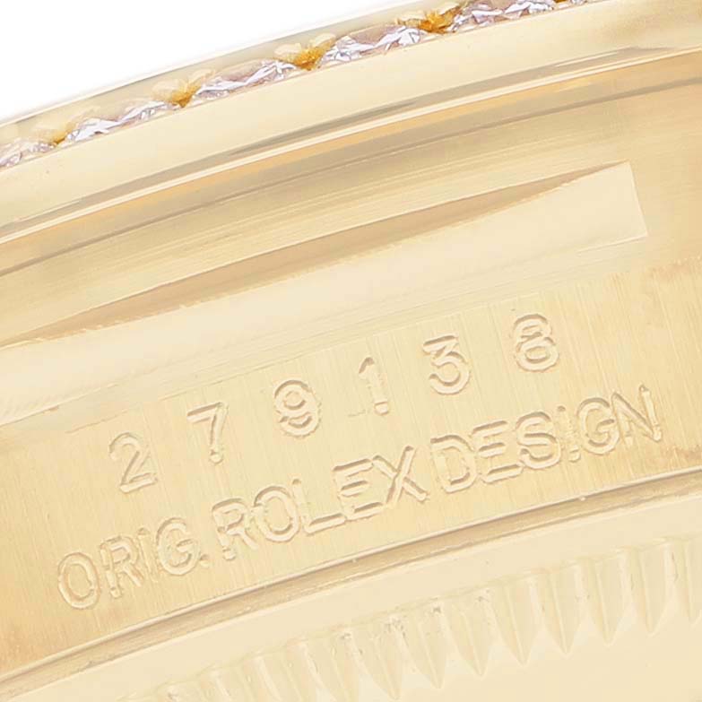 The image shows the side of a Rolex Datejust 279138 Women's Yellow Gold Green Dial, focusing on the engraved serial number and "ORIG. ROLEX DESIGN" text.