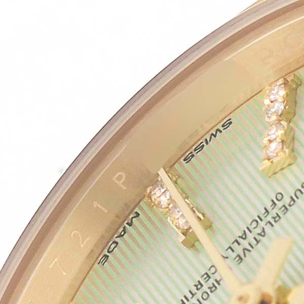 The image shows a partial view of the Rolex Datejust 279138 Women's Yellow Gold Green Dial watch face, focusing on the gold hour markers and dial edge.