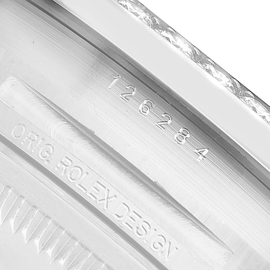 The image shows the inner engraving on the back of a Rolex Datejust 126284 Men's Stainless Steel Silver Dial watch, highlighting the design and model number.