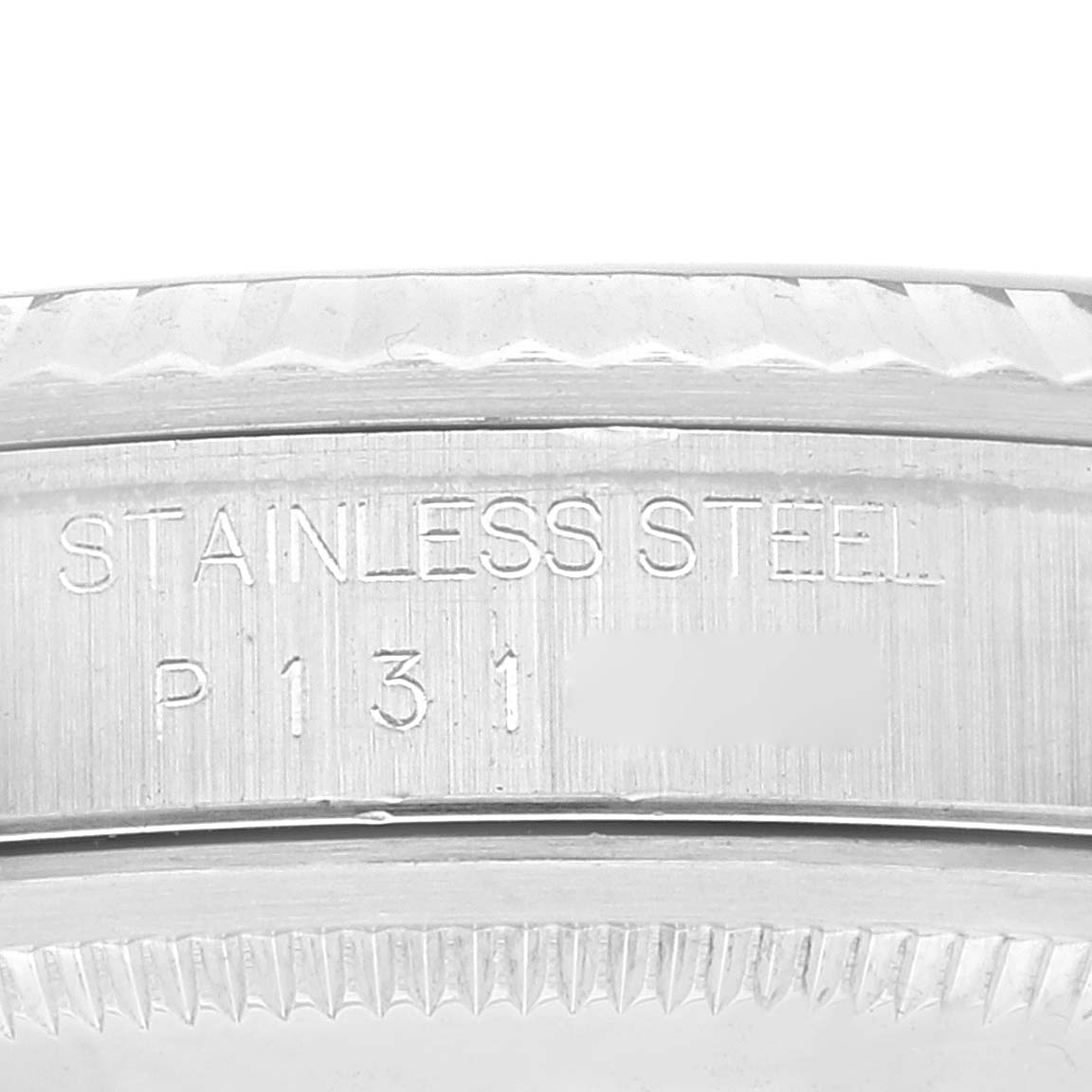 The image shows an engraved serial number on the stainless steel casing of a Rolex Datejust 16234 Men's Stainless Steel Black Dial 16234 Men's Stainless Steel Black Dial watch, viewed close-up.