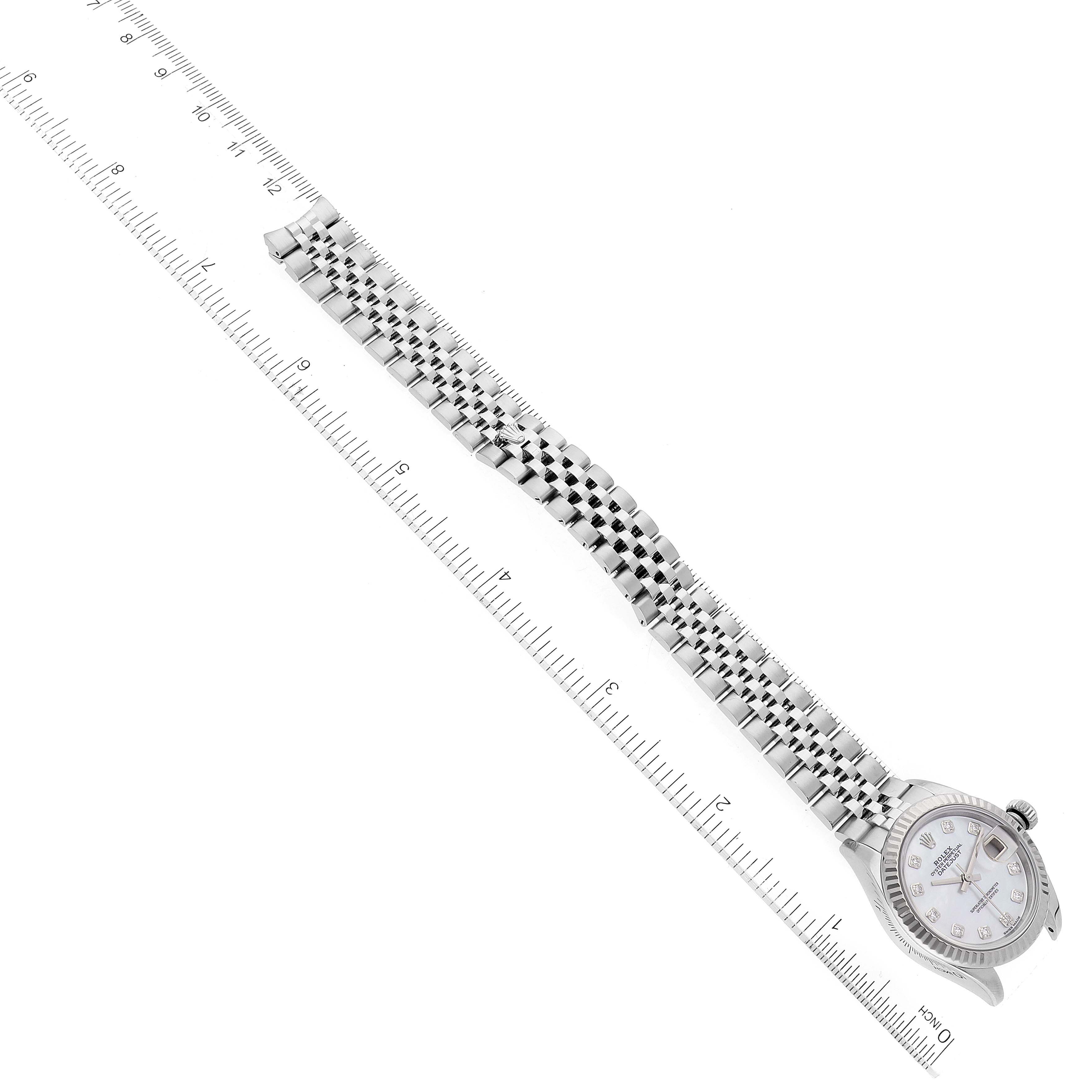 The image shows a Rolex Datejust 279174 Women's Stainless Steel Mother of Pearl Dial 279174 Women's Stainless Steel Mother of Pearl Dial watch with a stainless steel bracelet, laid out flat next to a measurement ruler.