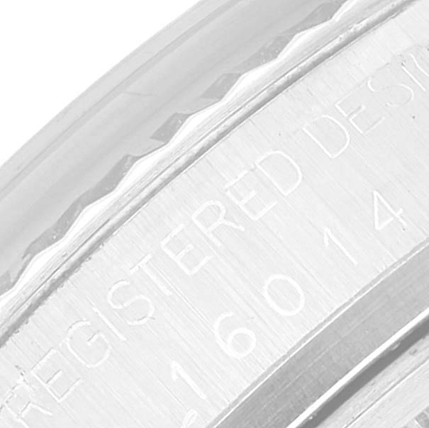 This image shows a close-up view of the side engraving on the bezel of a Rolex Datejust 16014 Men's Stainless Steel Silver Dial 16014 Men's Stainless Steel Silver Dial watch.