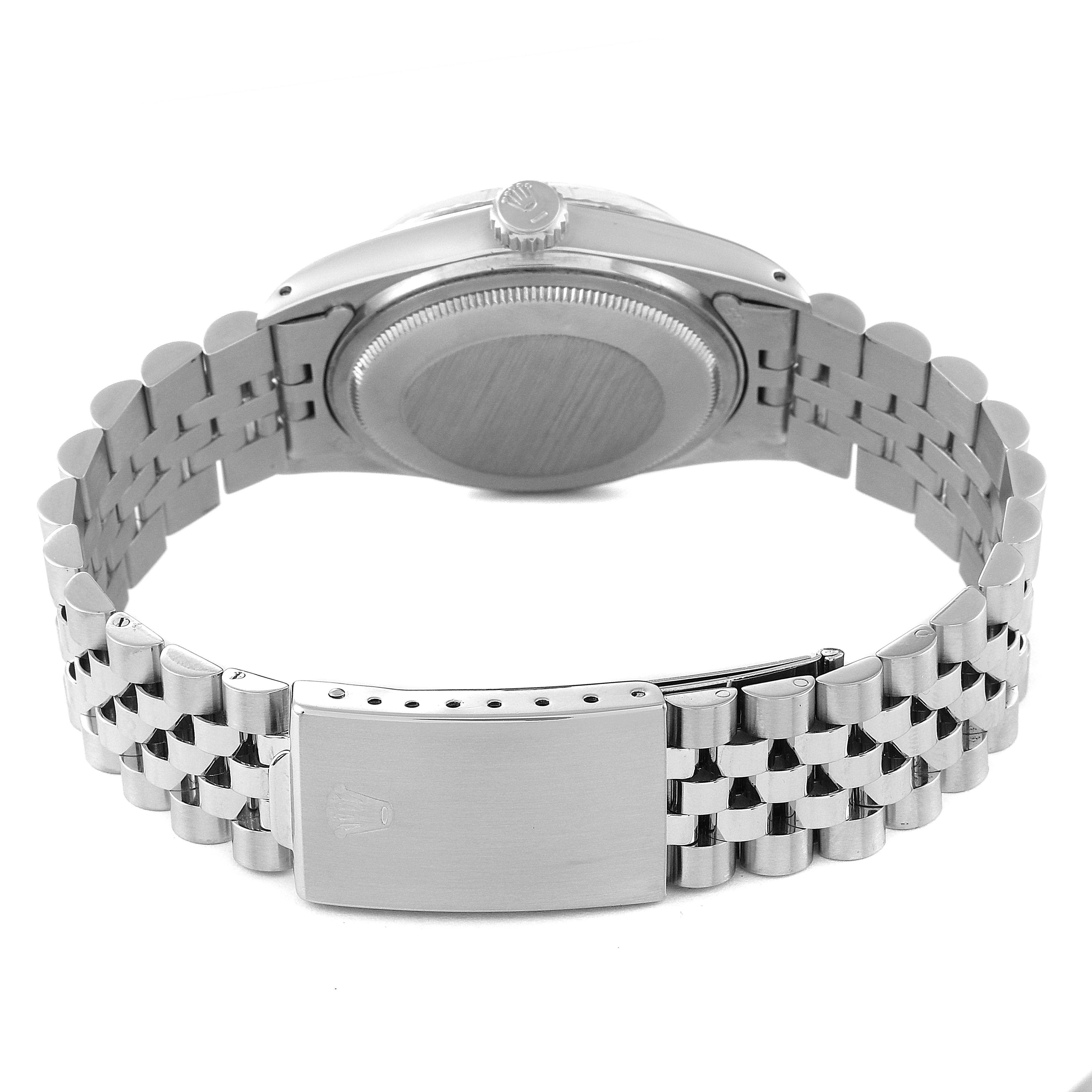 This image shows the backside and clasp of a Rolex Datejust 16014 Men's Stainless Steel Silver Dial 16014 Men's Stainless Steel Silver Dial watch, highlighting its bracelet and caseback.
