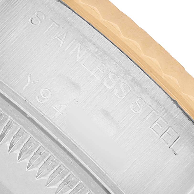 The image shows a close-up of the edge and engravings on the case back of a Rolex Datejust 79173 Women's Steel and Gold (two tone) Champagne Dial, highlighting "STAINLESS STEEL."