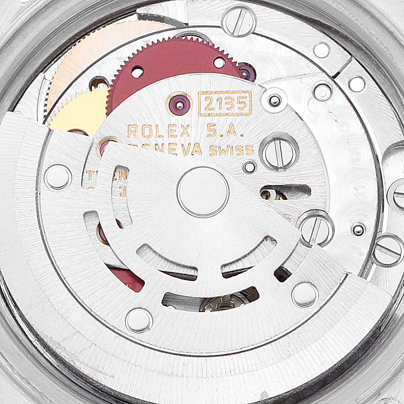 This close-up image shows the internal movement mechanism of a Rolex Datejust 69173 Women's Steel and Gold (two tone) Black Dial 69173 Women's Steel and Gold (two tone) Black Dial watch, highlighting gears and engravings.