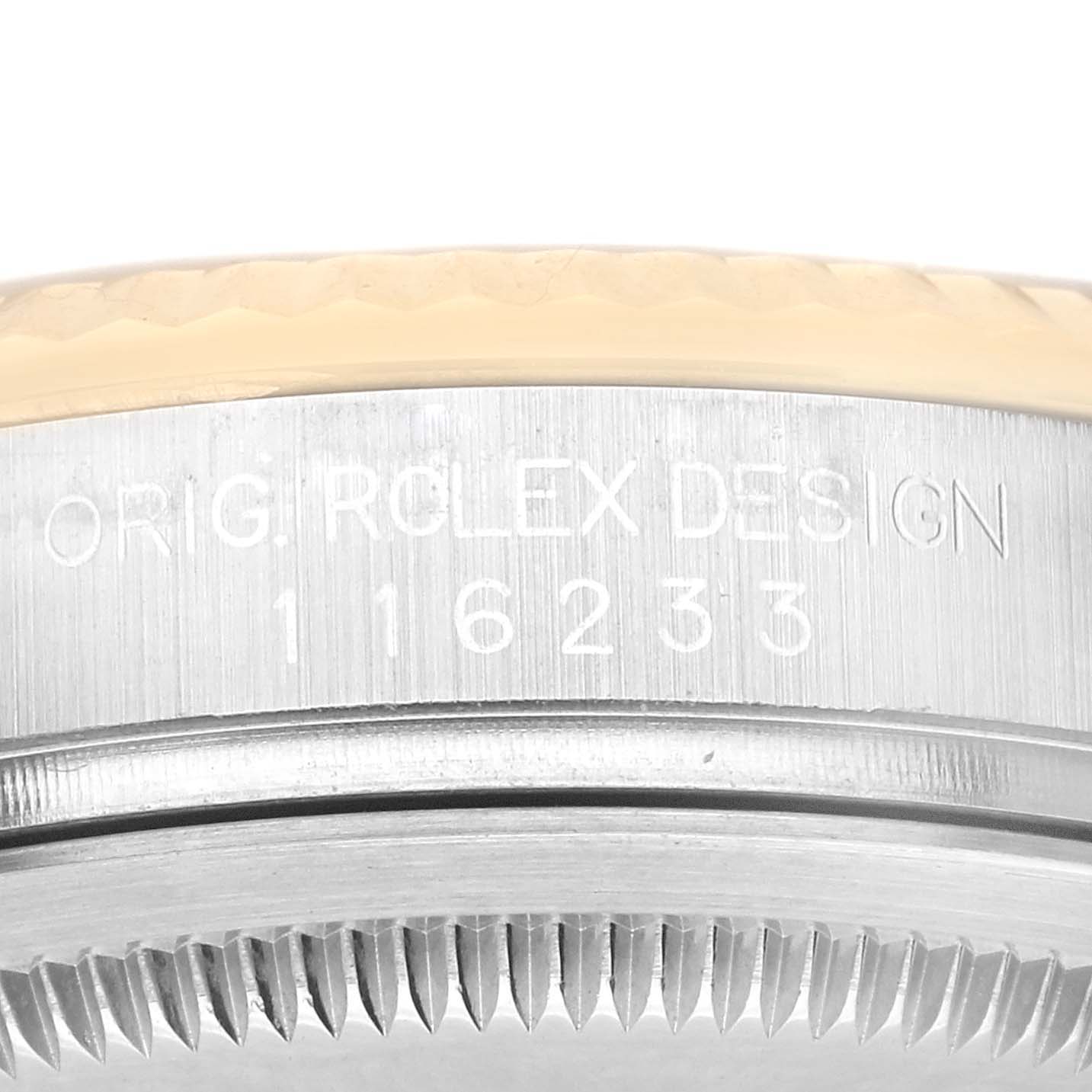 The image shows a close-up of the side engraving and the bezel edge of a Rolex Datejust 116233 Men's Stainless Steel Black Dial 116233 Men's Stainless Steel Black Dial watch.