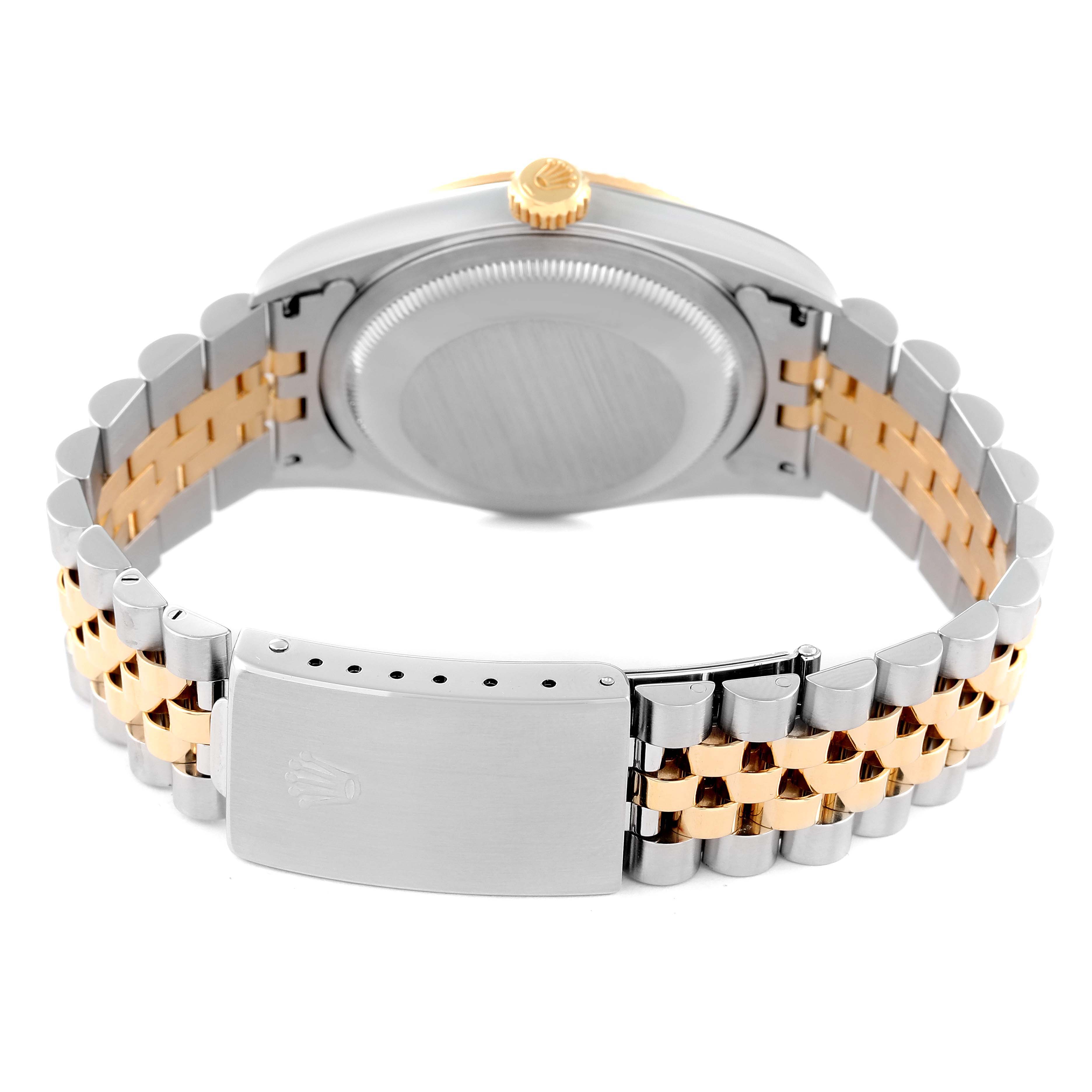 The image shows the back view of a Rolex Datejust 16233 Men's Steel and Gold (two tone) Champagne Dial 16233 Men's Steel and Gold (two tone) Champagne Dial watch, highlighting its case back, crown, and two-tone bracelet.