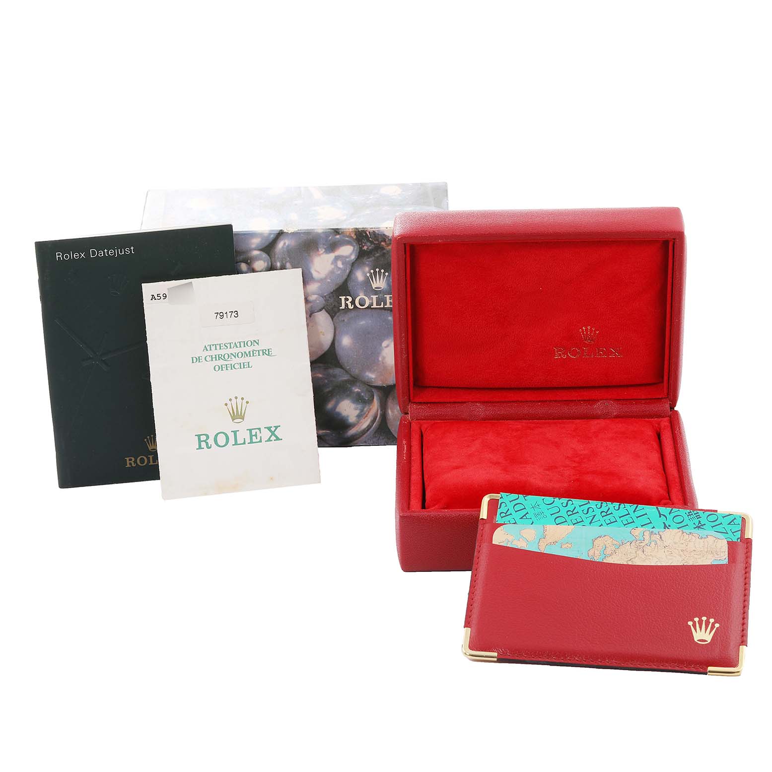 The image shows a Rolex Datejust 79173 Women's Steel and Gold (two tone) Champagne Dial 79173 Women's Steel and Gold (two tone) Champagne Dial watch box, booklets, and a red card holder at a slight angle.