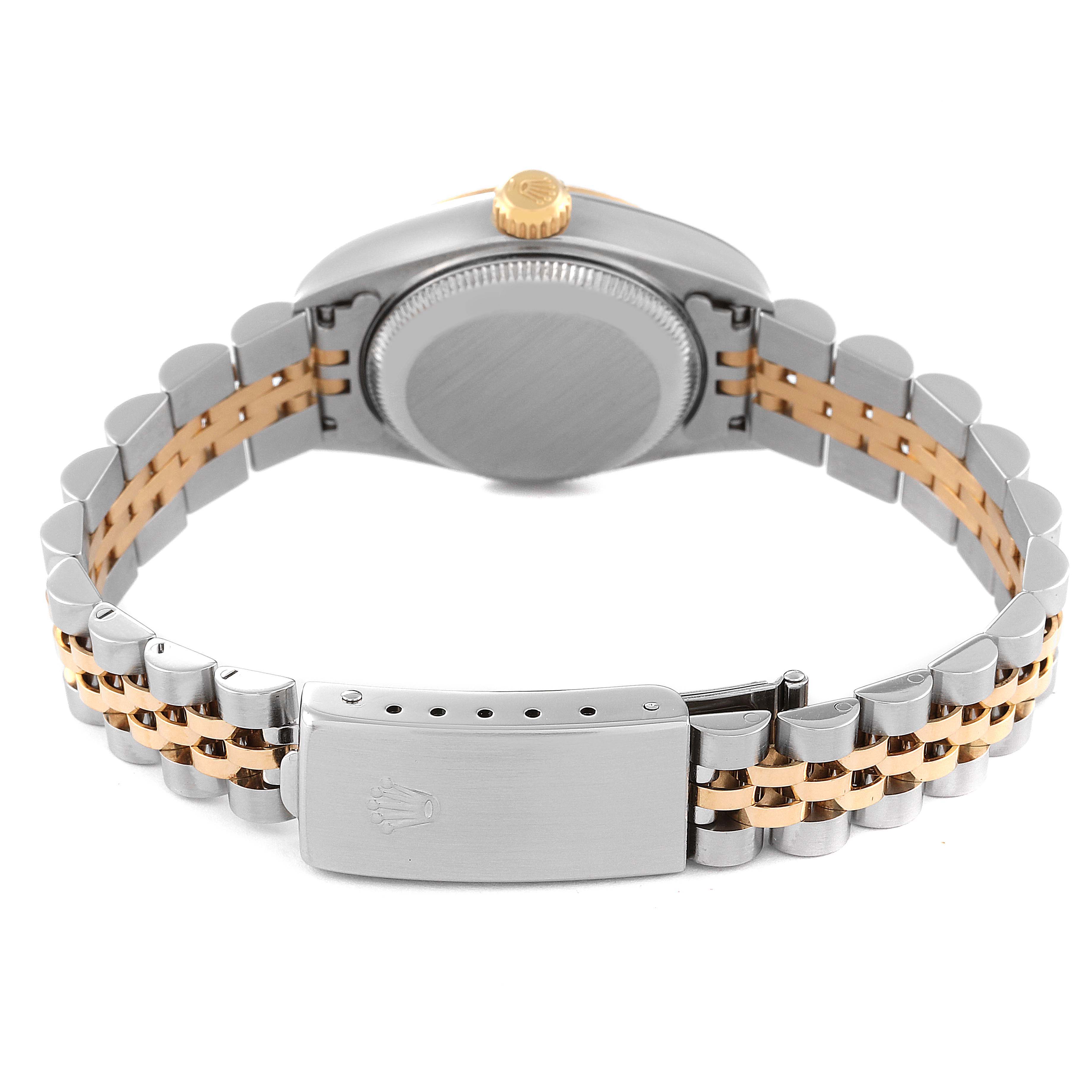 The image shows the back view of a Rolex Datejust 79173 Women's Steel and Gold (two tone) Champagne Dial 79173 Women's Steel and Gold (two tone) Champagne Dial watch, highlighting its case, crown, and two-tone Jubilee bracelet with clasp.