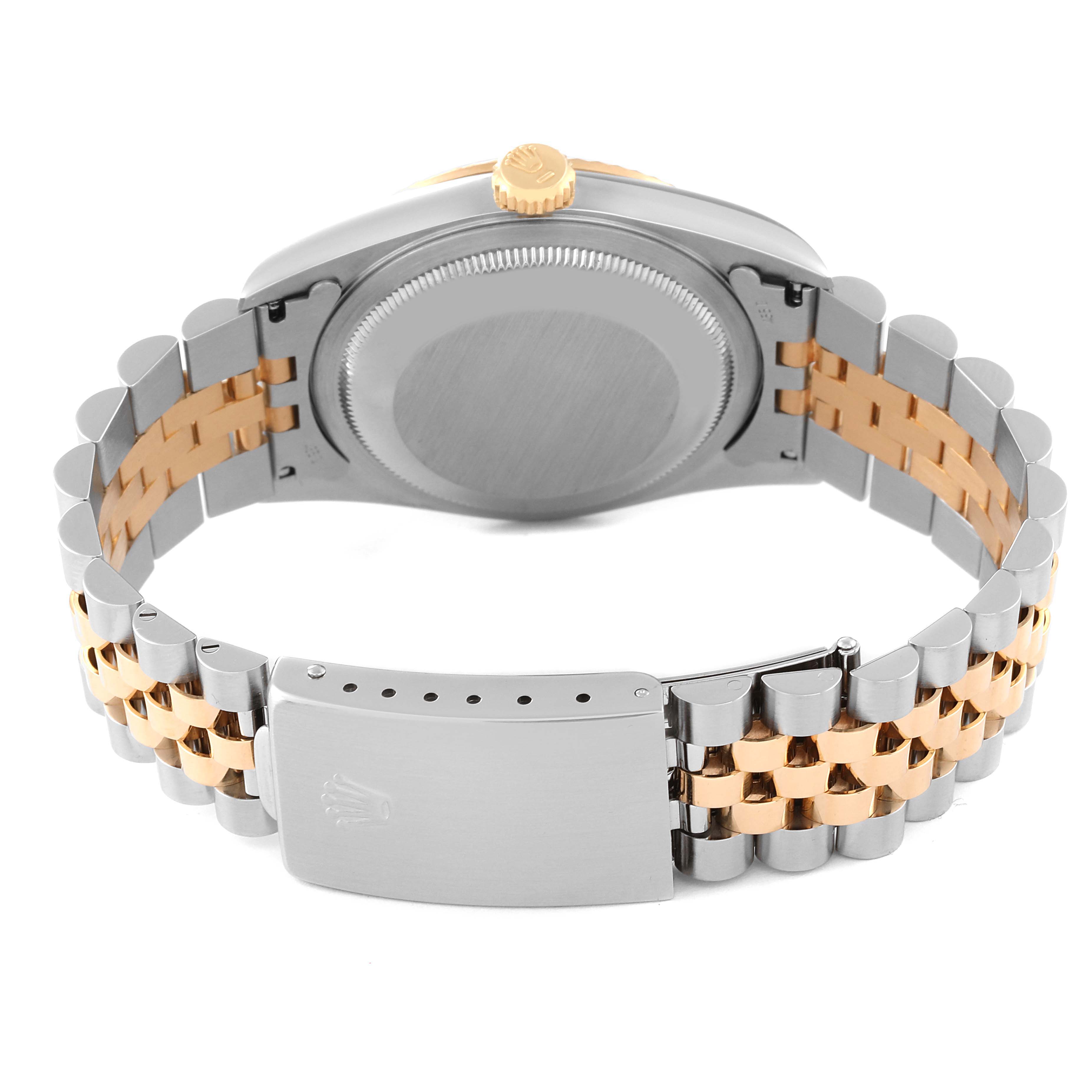 This image shows the back and bracelet of a Rolex Datejust 16233 Men's Steel and Gold (two tone) Champagne Dial 16233 Men's Steel and Gold (two tone) Champagne Dial watch, featuring a two-tone metal design with a gold crown.