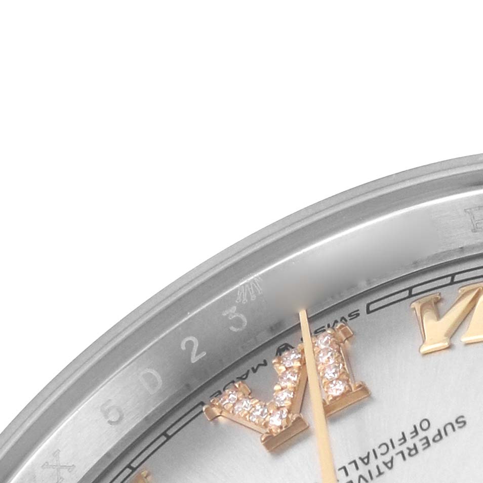 The close-up image of the Rolex Datejust 126233 Men's Steel and Gold (two tone) Silver Dial shows the bezel, partial dial, and diamond-encrusted Roman numeral markers.