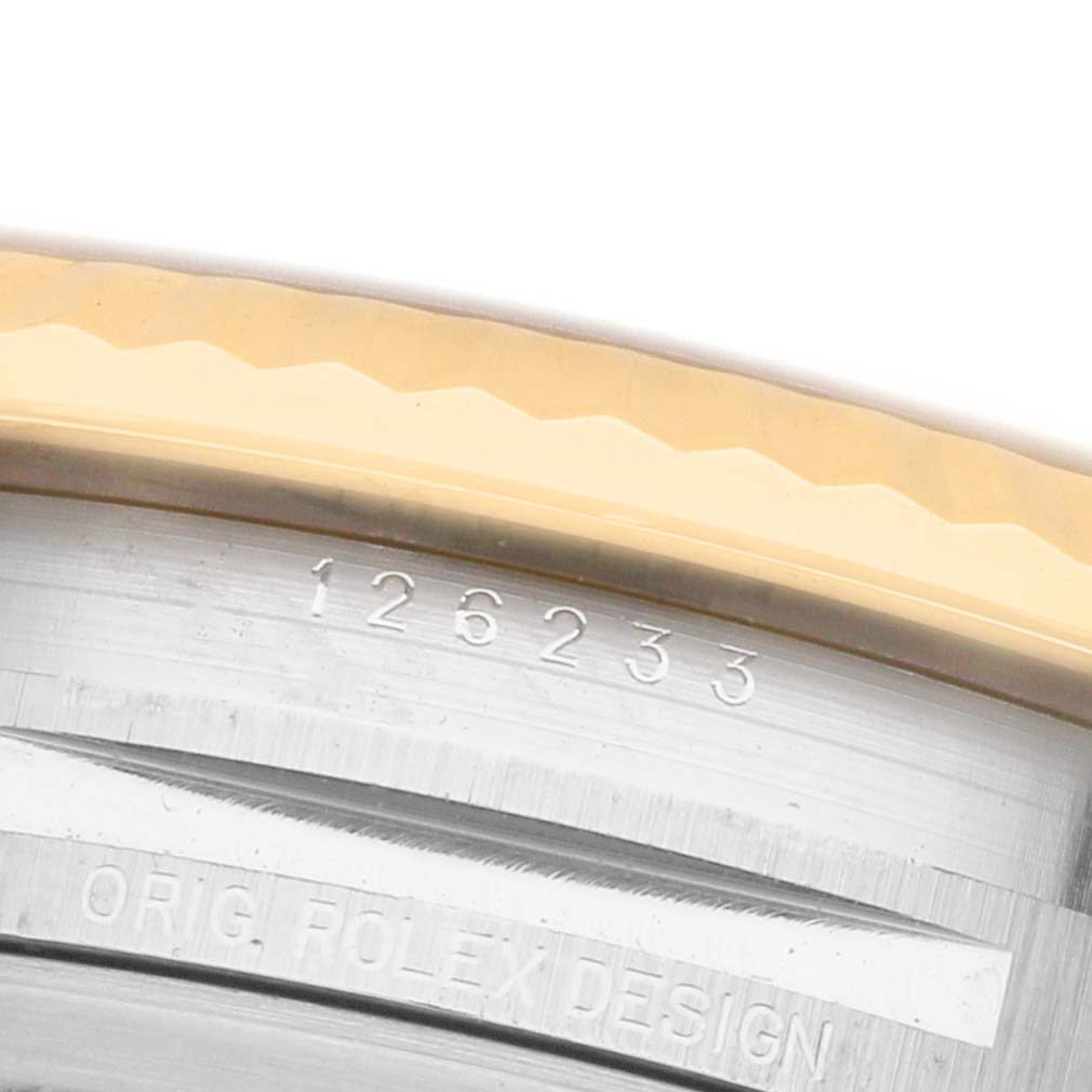 The image shows a close-up of the case edge and markings on the Rolex Datejust 126233 Men's Steel and Gold (two tone) Silver Dial, displaying the model number and part of the bezel.
