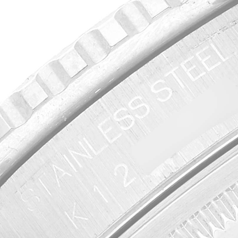 The image shows a close-up of the bezel and edge of the case back of a Rolex Turn-o-Graph 16264 Men's Stainless Steel White Dial 16264 Men's Stainless Steel White Dial watch, emphasizing the "STAINLESS STEEL" text.