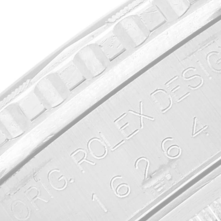 This close-up image shows the engraved bezel and case serial number of a Rolex Turn-o-Graph 16264 Men's Stainless Steel White Dial 16264 Men's Stainless Steel White Dial watch.