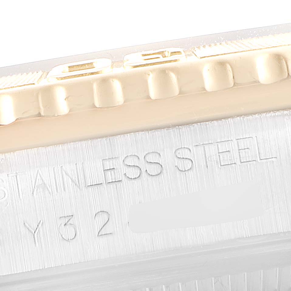 This close-up angle of the Rolex Turn-o-Graph 16263 Men's Steel and Gold (two tone) Grey Dial 16263 Men's Steel and Gold (two tone) Grey Dial watch shows the side casing with engraved text indicating it is made of stainless steel.