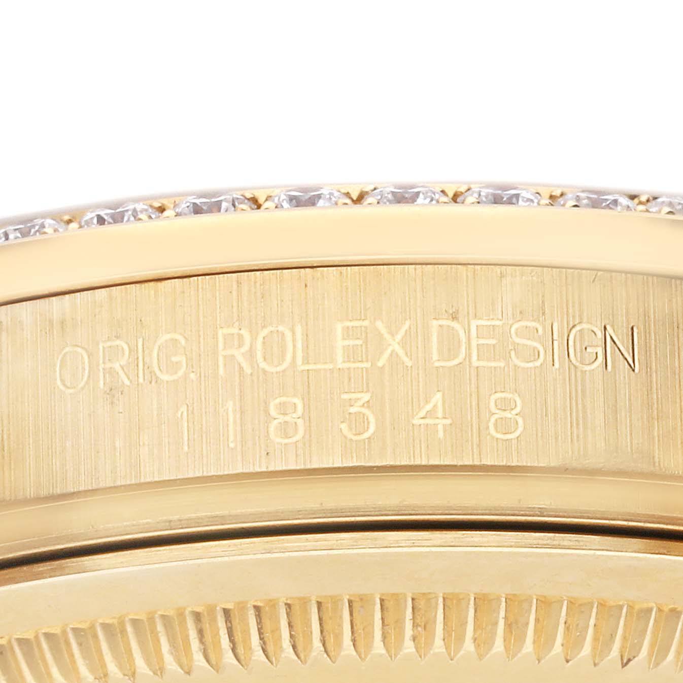 The image displays the side view of the case back and part of the bezel of the Rolex President 118348 Men
s Yellow Gold Champagne Dial 118348 Men
s Yellow Gold Champagne Dial model, showcasing the engraved model number 118348.