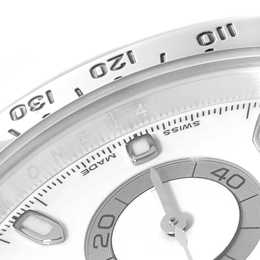 The image shows a close-up of the dial and bezel of a Rolex Daytona 116520 Men's Stainless Steel White Dial 116520 Men's Stainless Steel White Dial, focusing on the numbers and markers.