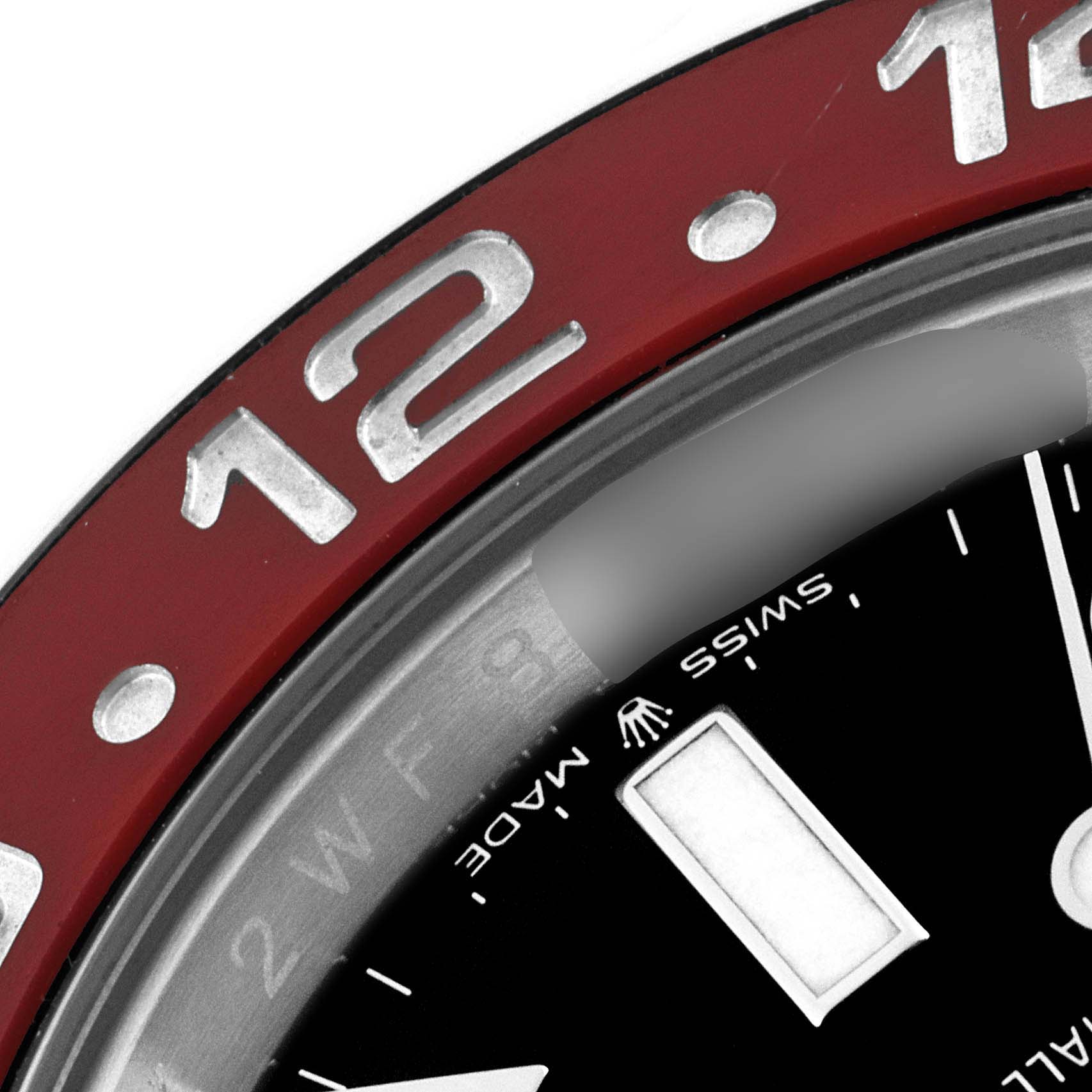 The image shows a close-up of the bezel and part of the dial of a Rolex GMT-Master 126710BLRO Men's Stainless Steel Black Dial 126710BLRO Men's Stainless Steel Black Dial watch.