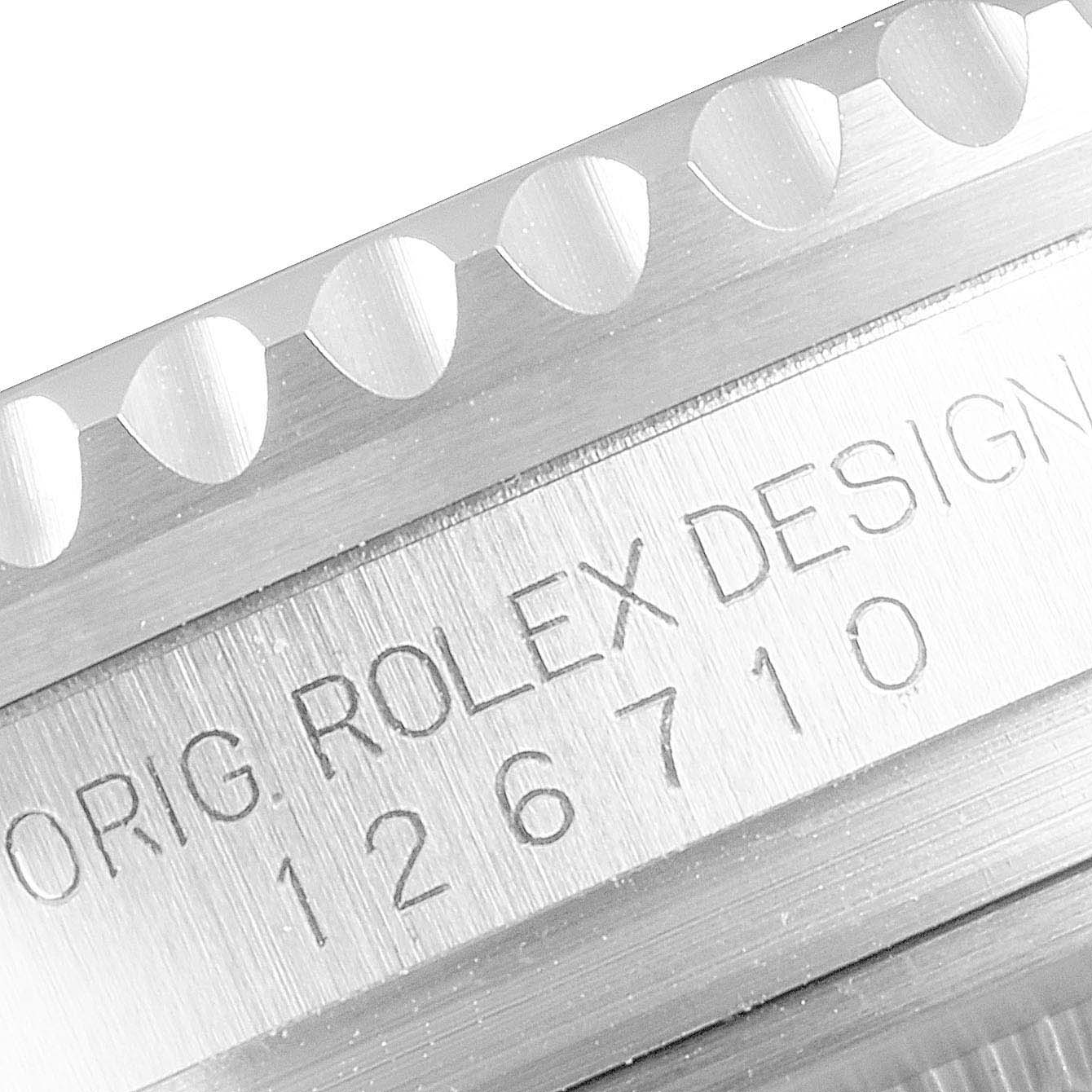 This close-up image shows the engraved side of the bezel and case of a Rolex GMT-Master 126710BLRO Men's Stainless Steel Black Dial 126710BLRO Men's Stainless Steel Black Dial watch.