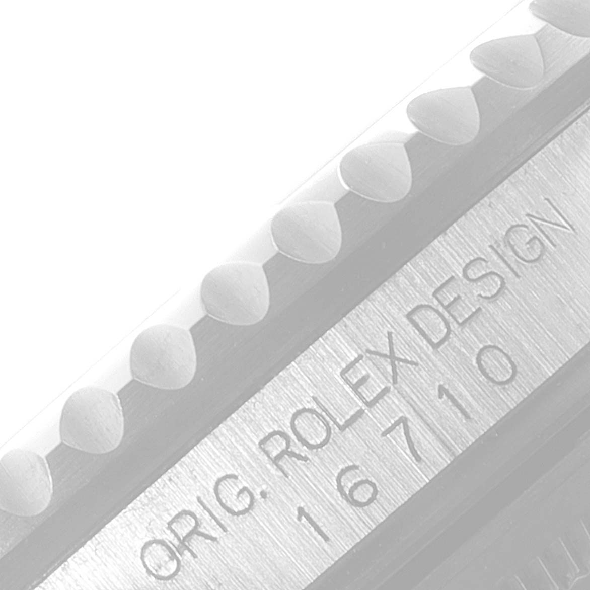 The image shows a close-up of the side of the bezel and case with engravings of the Rolex GMT-Master 16710 Men
s Stainless Steel Black Dial 16710 Men
s Stainless Steel Black Dial watch.