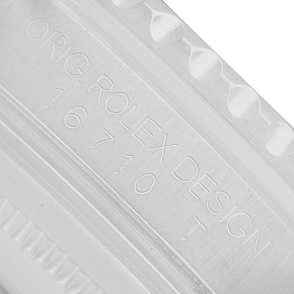 The image shows an angled close-up of the model number engraving on a Rolex GMT-Master 16710 Men's Stainless Steel Black Dial watch case.
