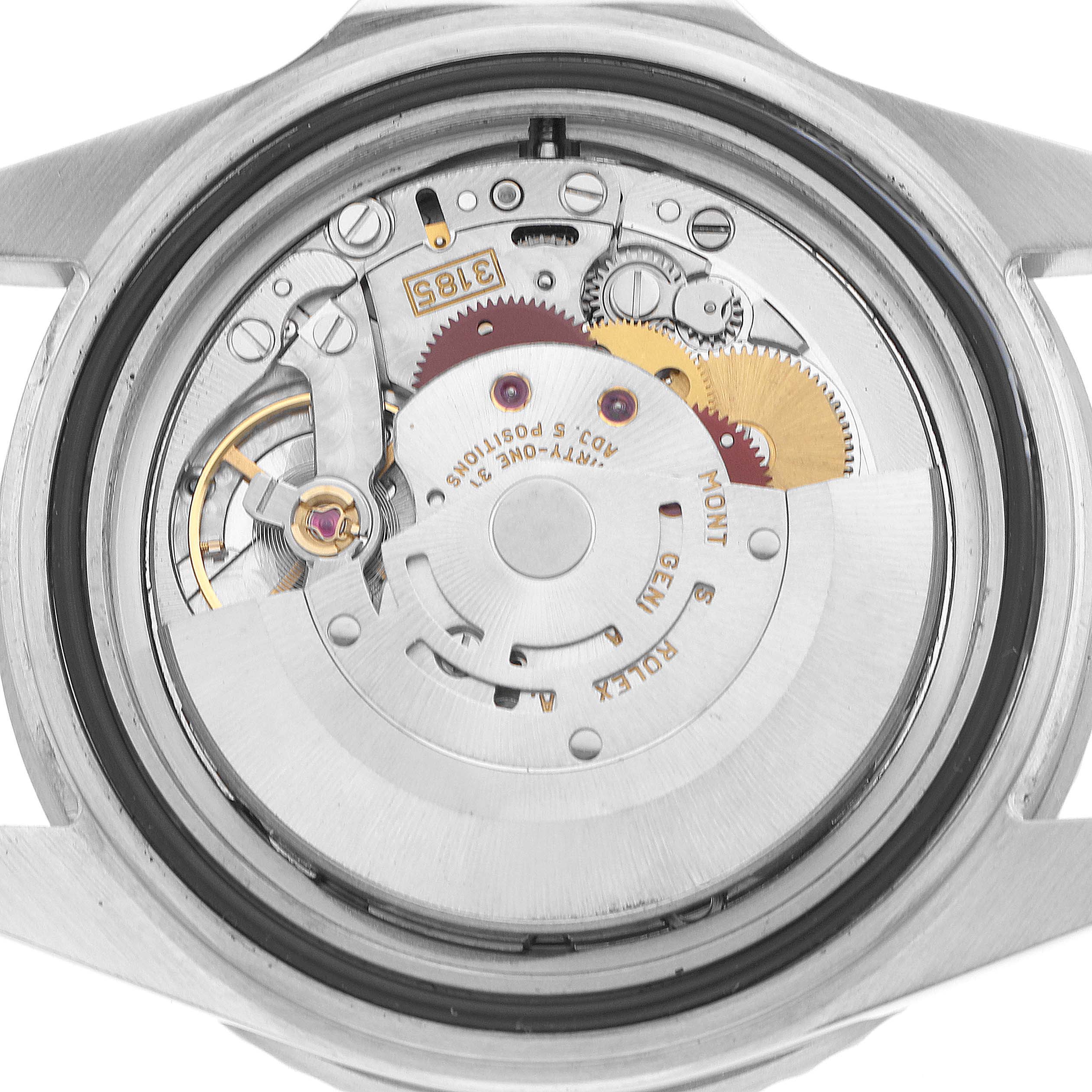 The image shows the back casing of a Rolex GMT-Master 16710 Men's Stainless Steel Black Dial watch, revealing its intricate mechanical movement.