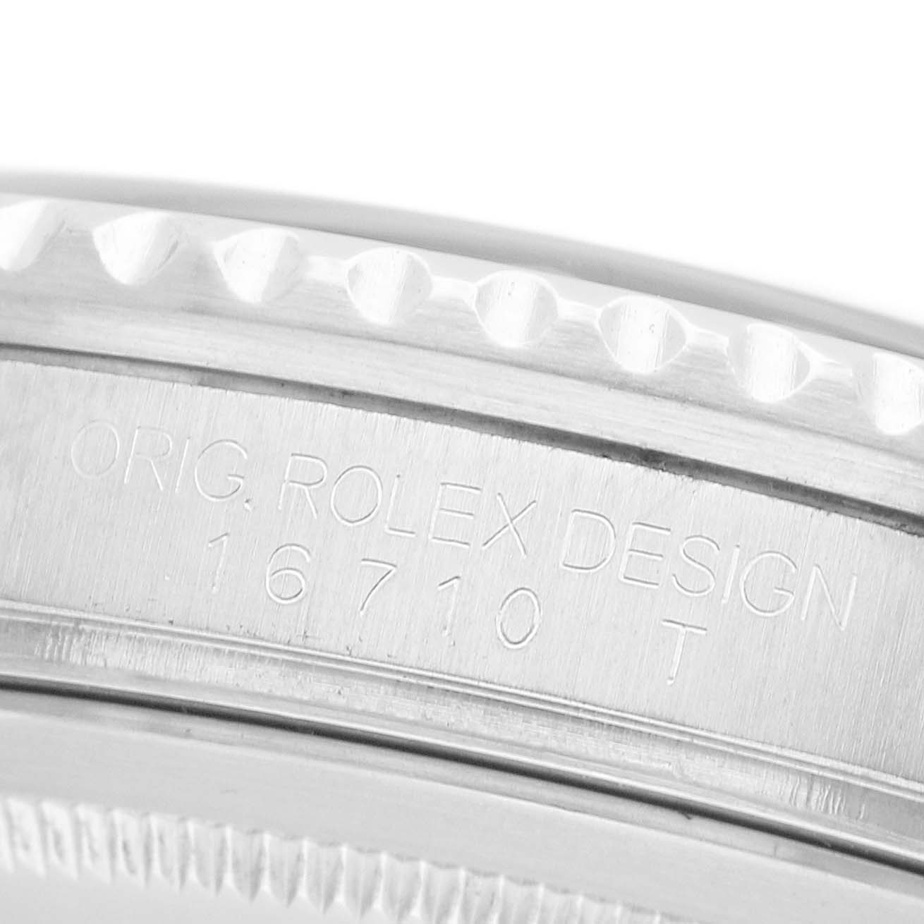 The image shows a close-up of the side of a Rolex GMT-Master 16710 Men's Stainless Steel Black Dial watch case, highlighting the model number and engravings.
