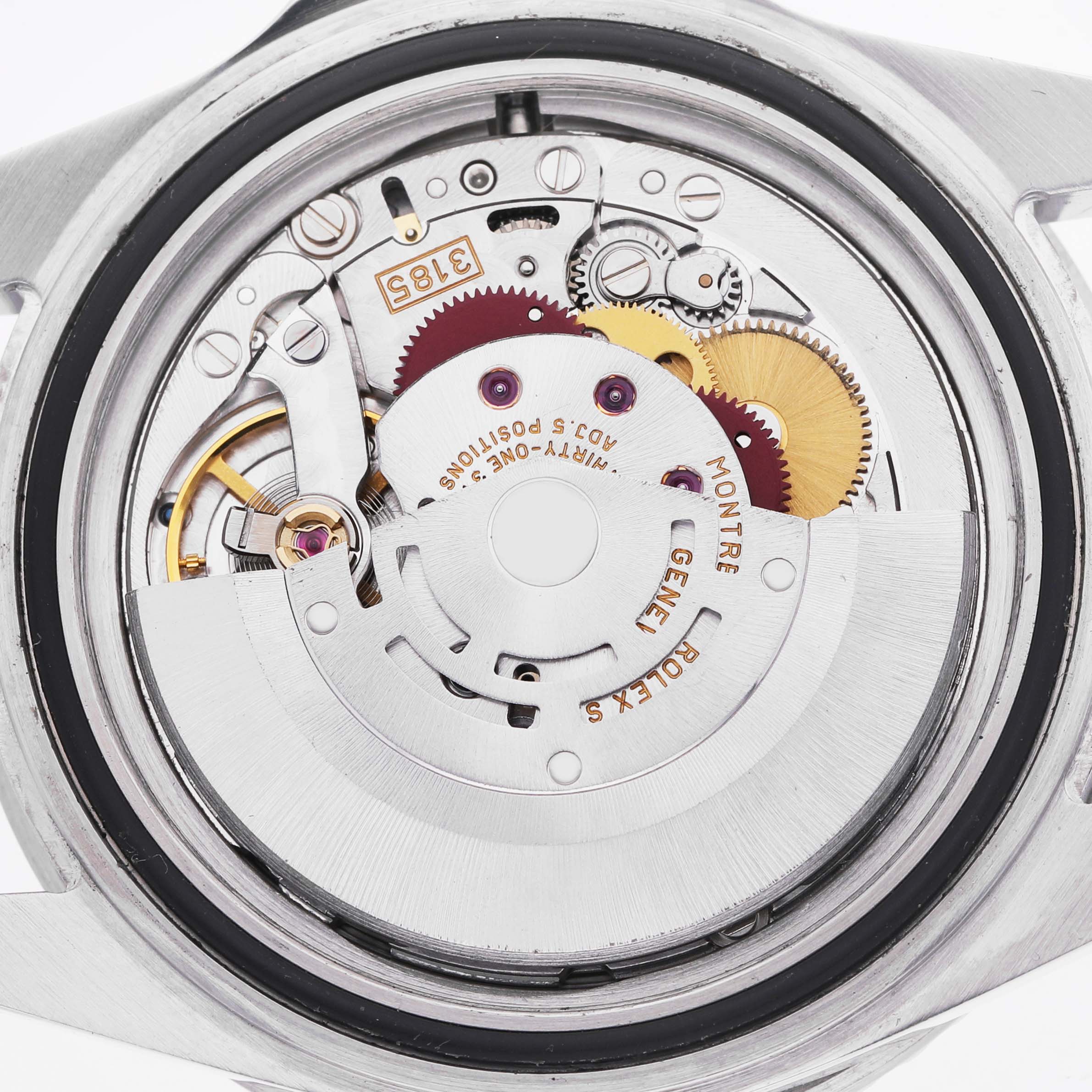 This is a view of the movement inside the Rolex GMT-Master 16710 Men's Stainless Steel Black Dial, showcasing gears and the rotor mechanism.