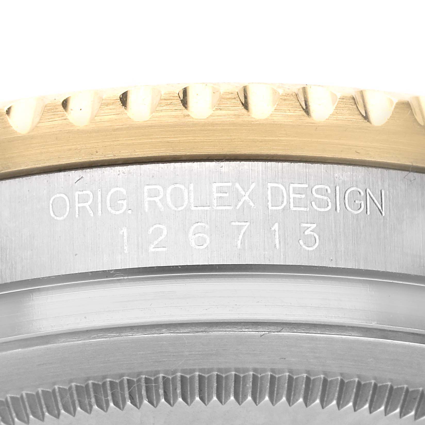 The image shows a close-up of the side of the Rolex GMT-Master 126713 Men's Steel and Gold (two tone) Black Dial 126713 Men's Steel and Gold (two tone) Black Dial watch, focusing on the model number, bezel, and case.