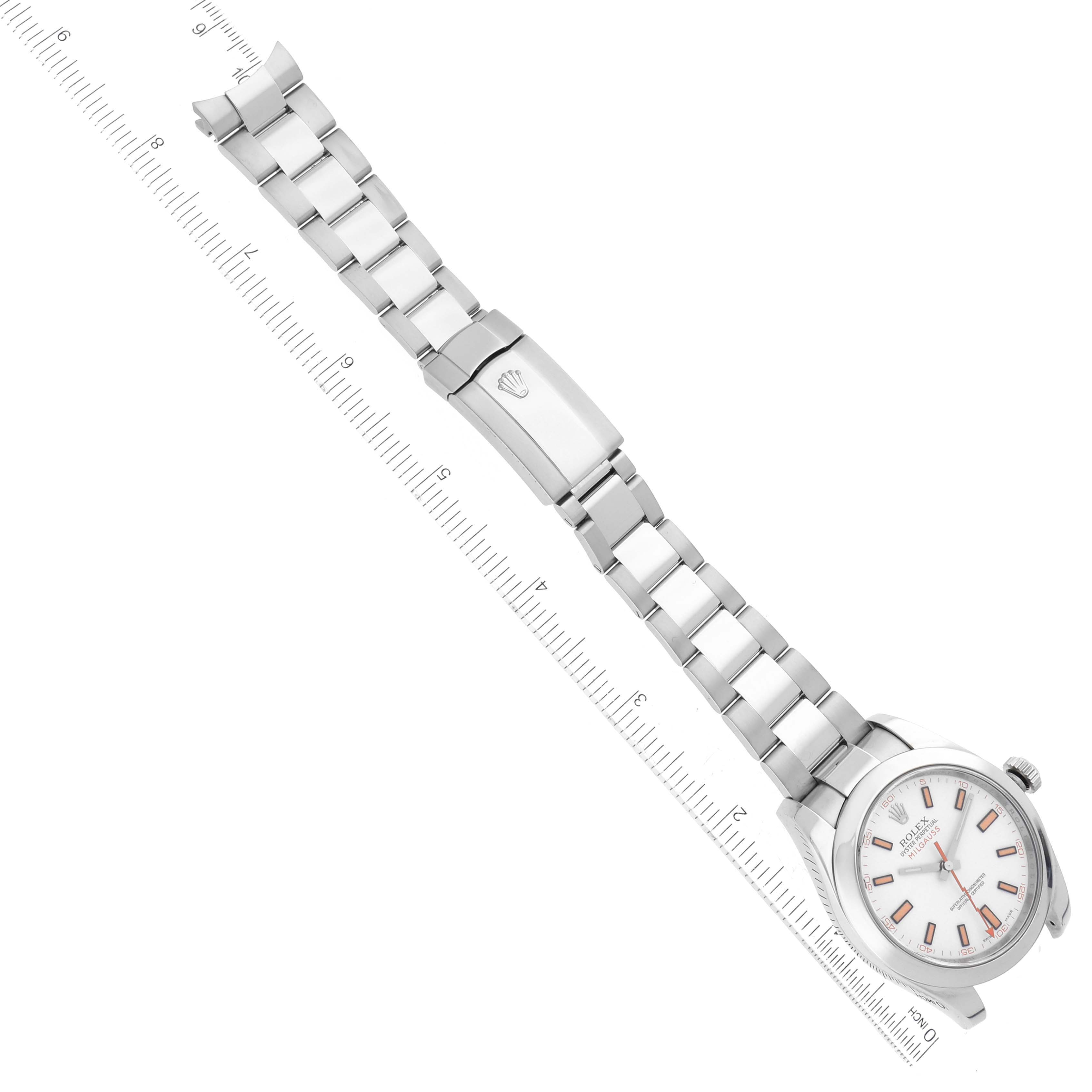The image displays a Rolex Milgauss 116400 Men's Stainless Steel White Dial 116400 Men's Stainless Steel White Dial watch laid flat with its bracelet parallel to a ruler for measurement.
