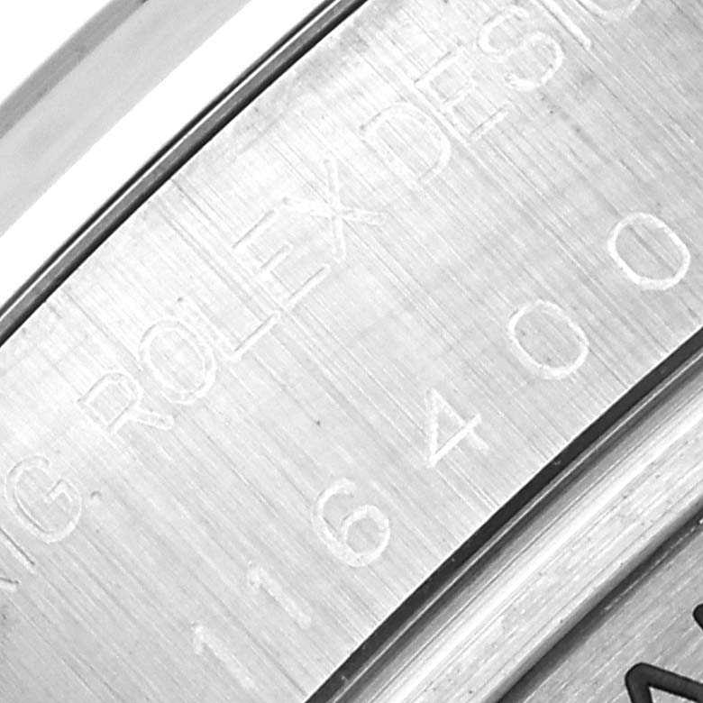 Close-up shot of the inner bezel showing the engraved serial number of a Rolex Milgauss 116400 Men's Stainless Steel White Dial 116400 Men's Stainless Steel White Dial watch.
