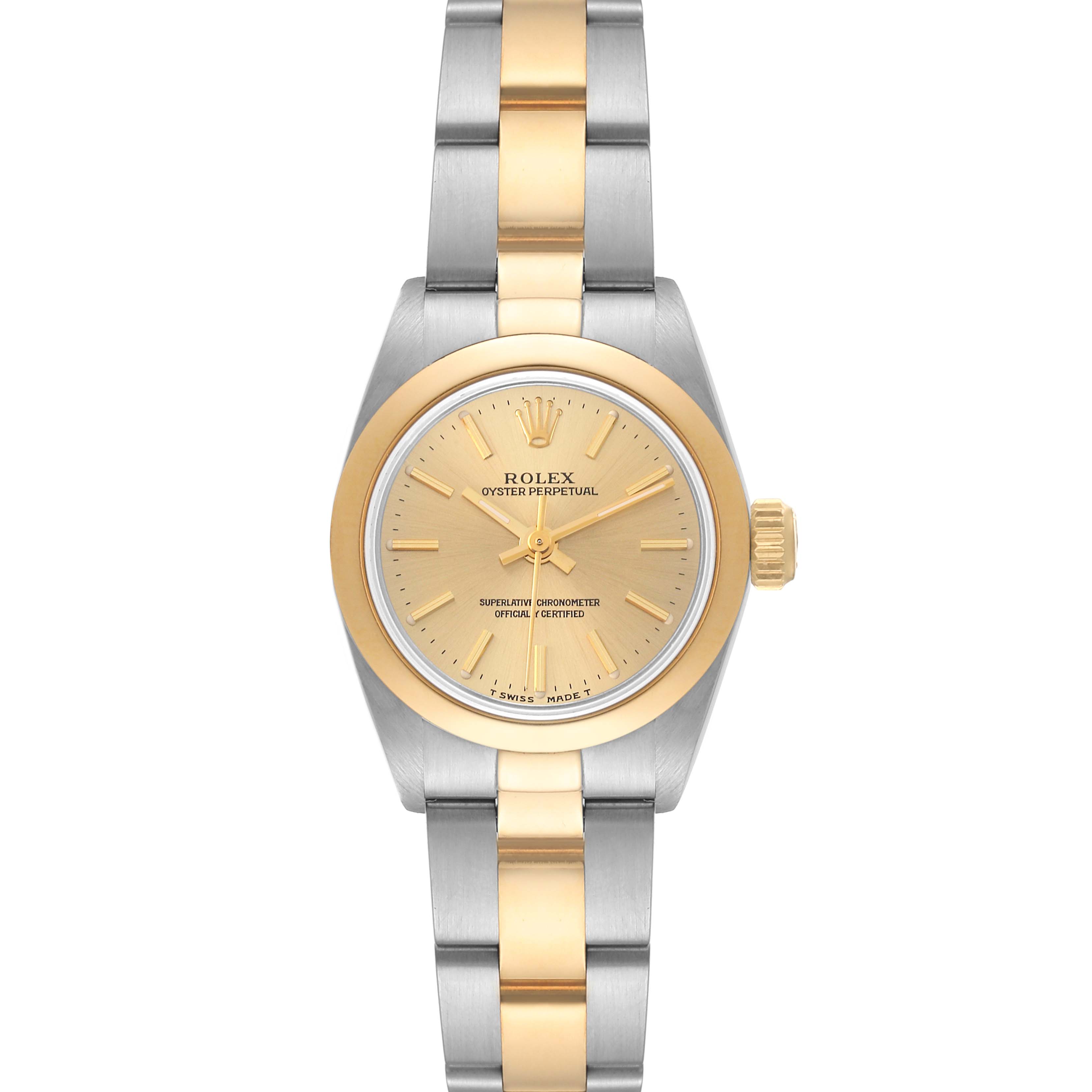 This Rolex Oyster Perpetual 67183 Women's Steel and Gold (two tone) Champagne Dial 67183 Women's Steel and Gold (two tone) Champagne Dial watch is shown from the front, highlighting its gold and silver case, dial, and bracelet.