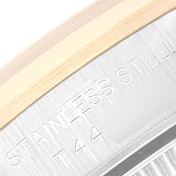 The image shows a close-up of the watch interior and the edge of the case for a Rolex Oyster Perpetual 67183 Women's Steel and Gold (two tone) Champagne Dial 67183 Women's Steel and Gold (two tone) Champagne Dial.