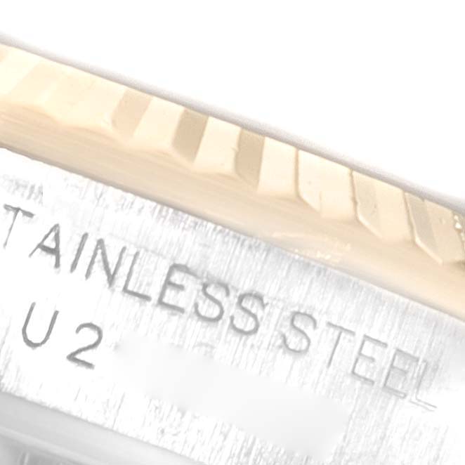 The image shows a close-up of the case side and fluted bezel of a Rolex Oyster Perpetual 67193 Women's Steel and Gold (two tone) White Dial 67193 Women's Steel and Gold (two tone) White Dial watch.