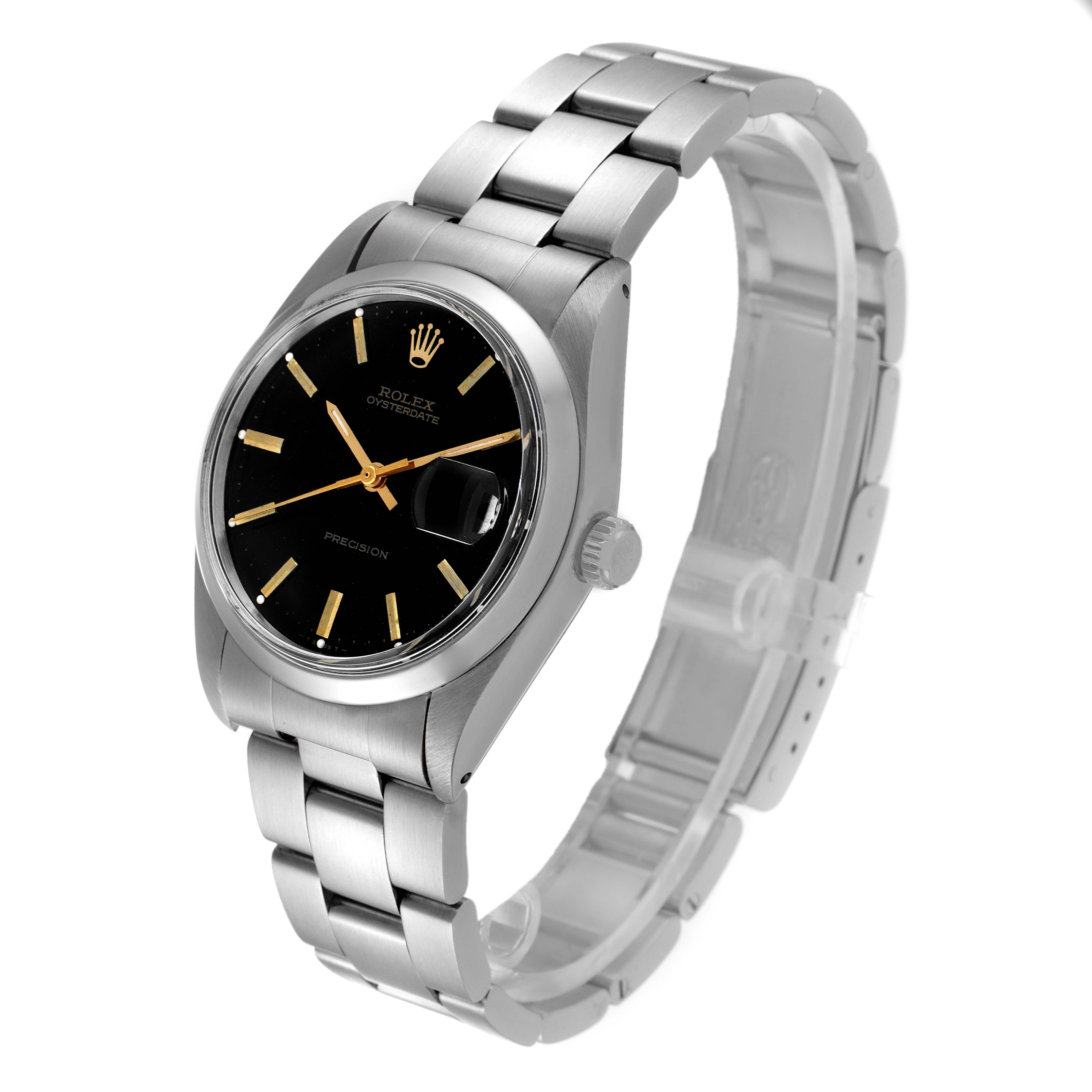 The Vintage Collection Rolex watch is shown at a slight angle, highlighting its black dial, metal bracelet, and date magnifier.