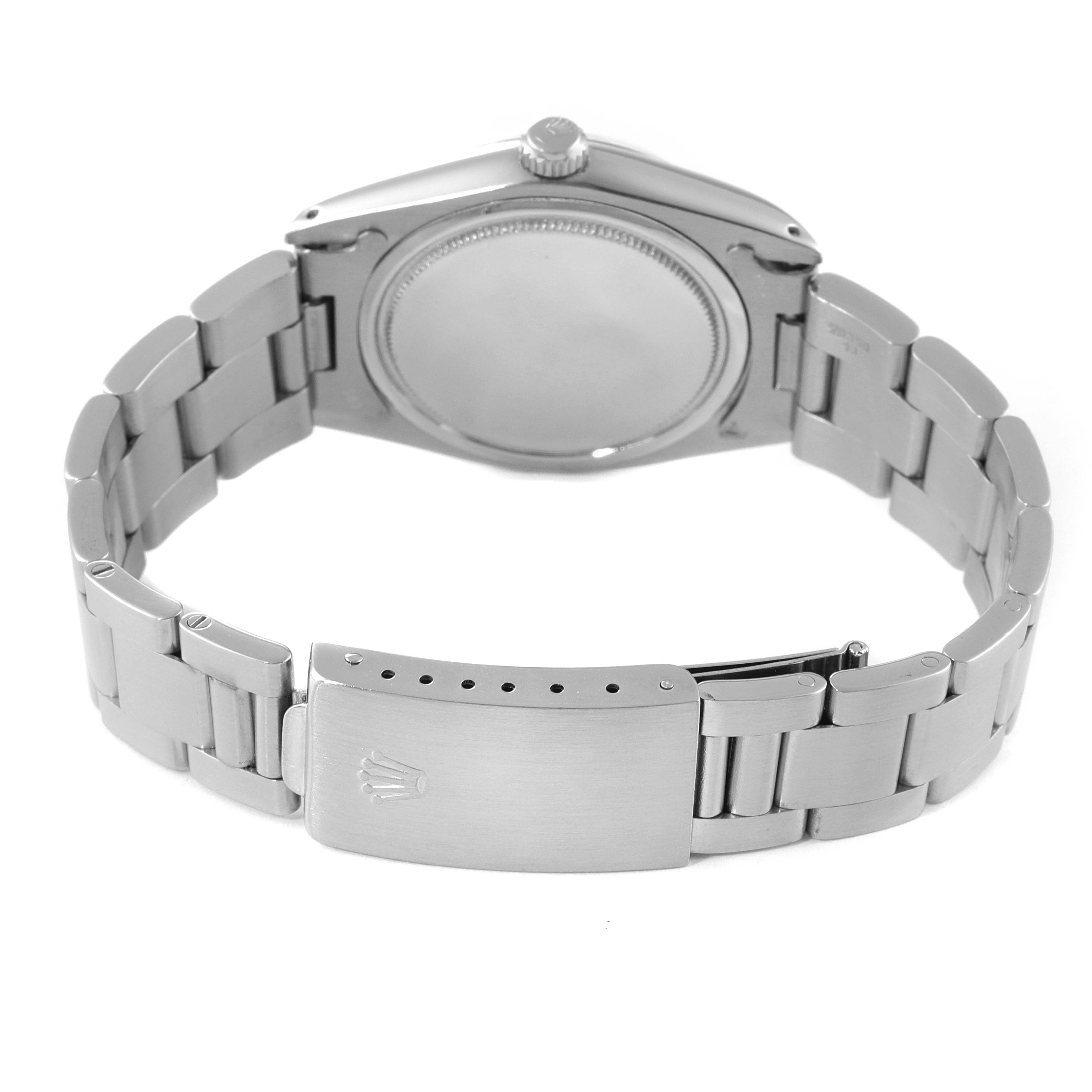 The image shows the back view of the Rolex Vintage Collection 6694 Men's Stainless Steel Black Dial 6694 Men's Stainless Steel Black Dial watch, highlighting its case back and metal bracelet with a clasp.