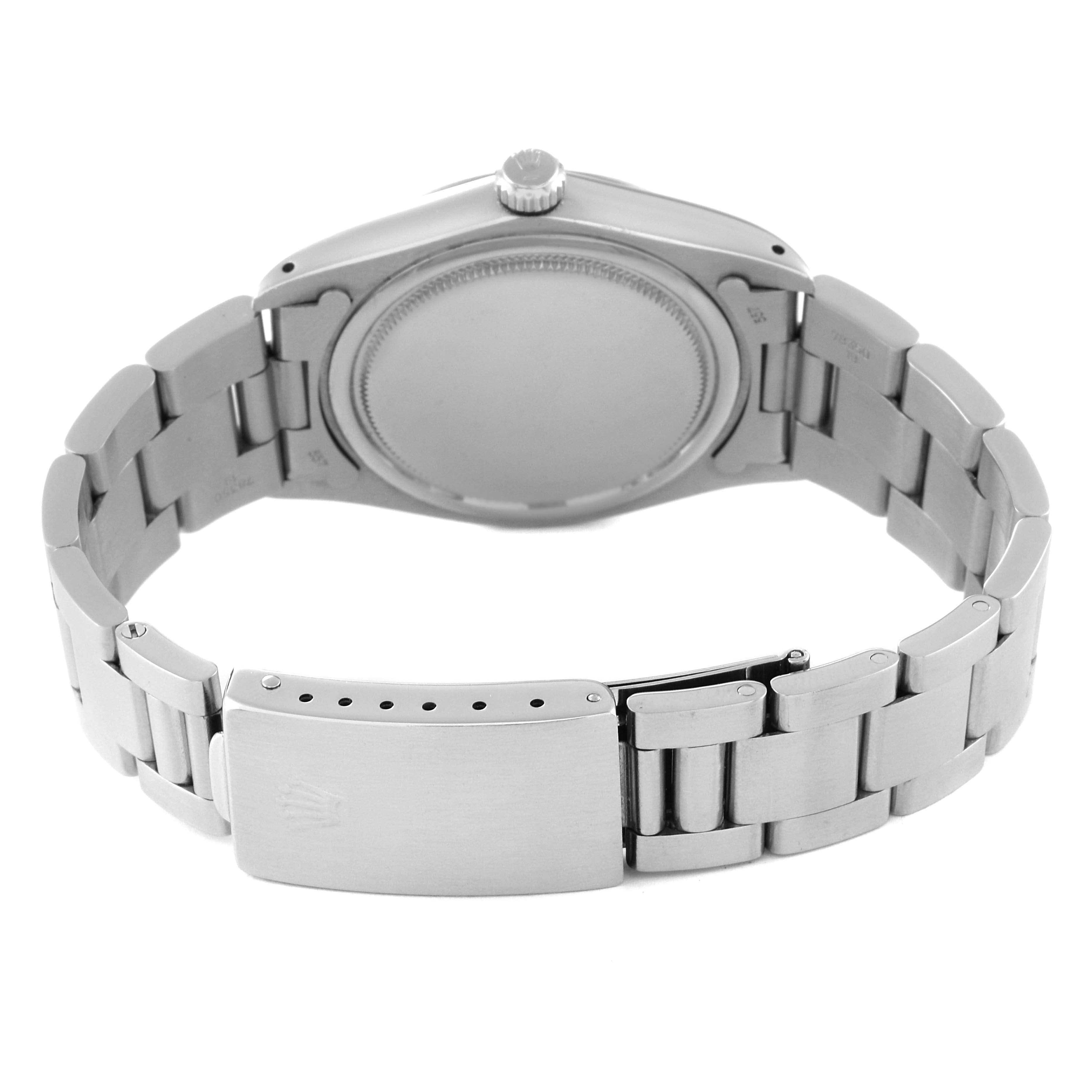 The image shows the back case and clasp of a Rolex Vintage Collection 6694 Men
s Stainless Steel Silver Dial 6694 Men
s Stainless Steel Silver Dial watch, highlighting the bracelet and crown.