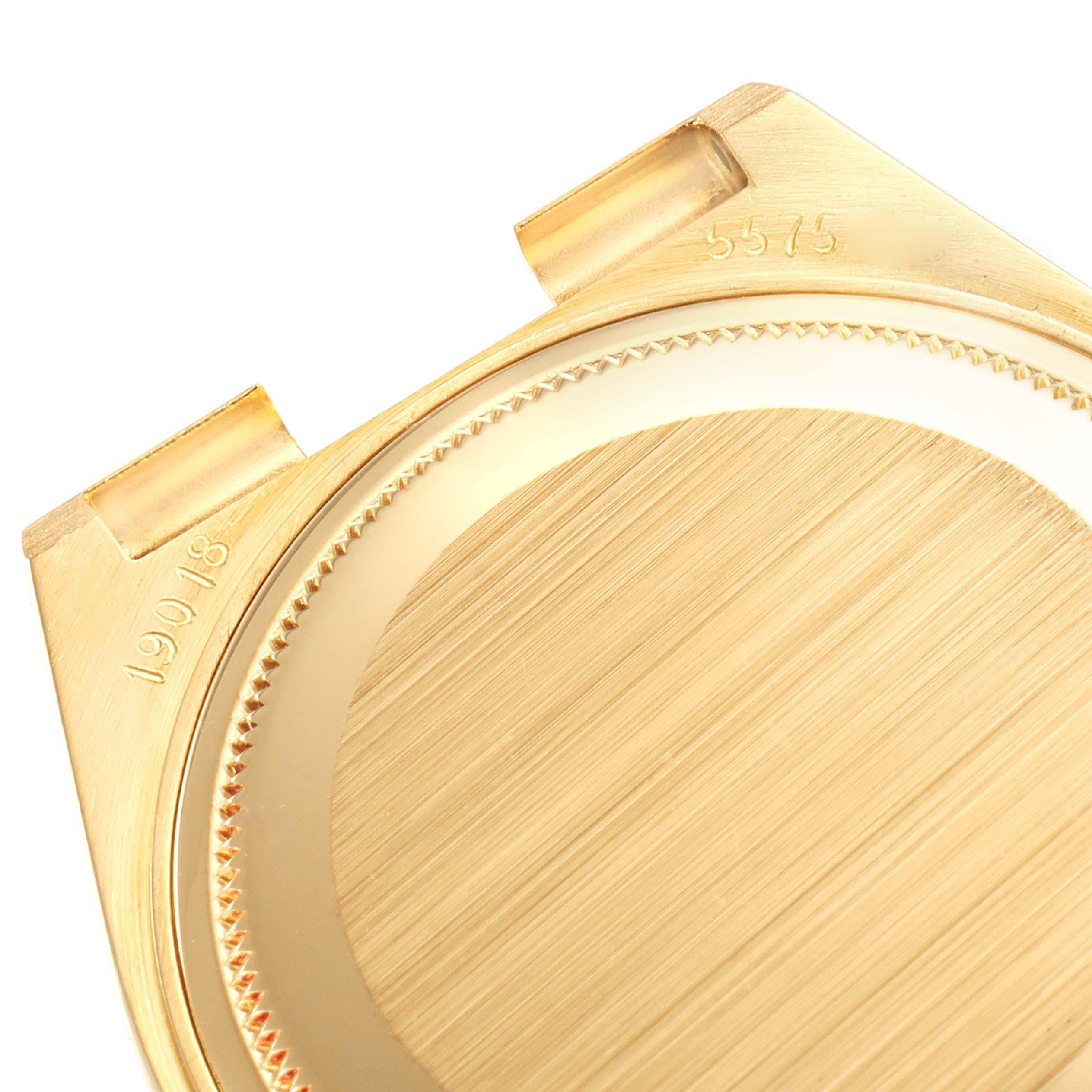 The image shows the back cover of the Rolex Oysterquartz 19018 Men
s Yellow Gold Champagne Dial 19018 Men
s Yellow Gold Champagne Dial model watch at a close-up angle.