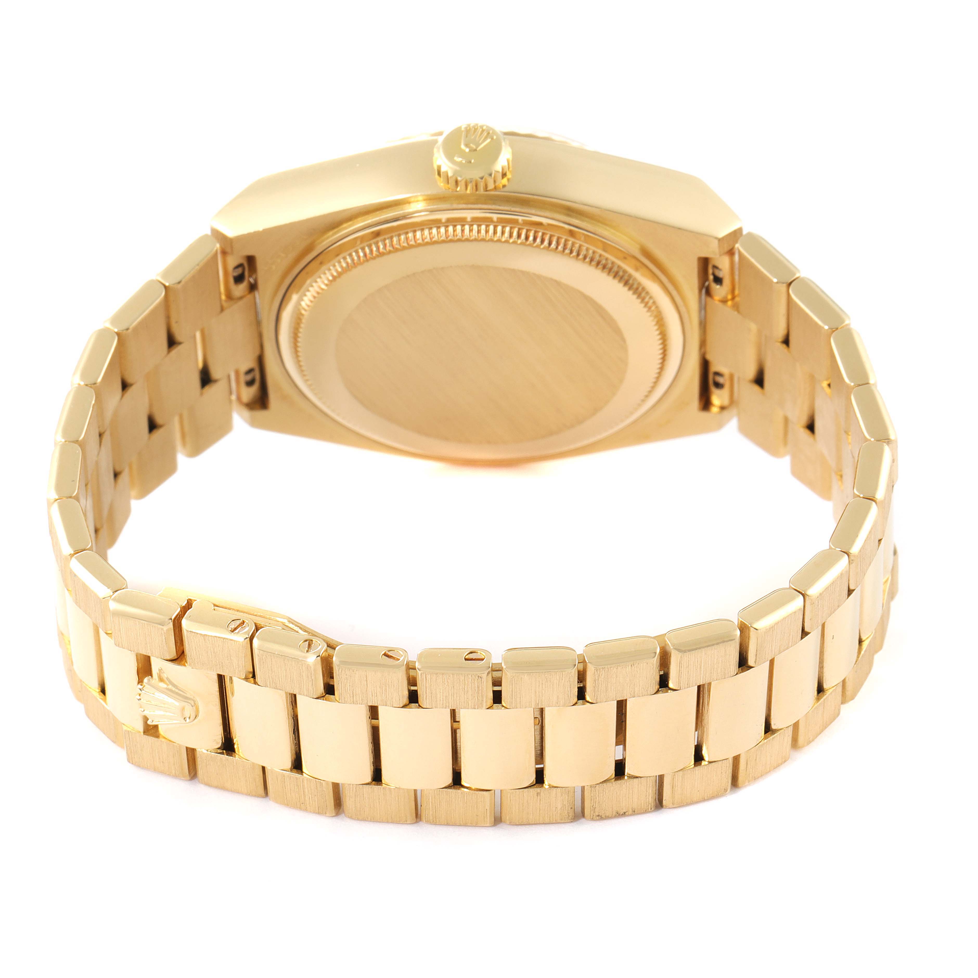 The image shows the back of a Rolex Oysterquartz 19018 Men
s Yellow Gold Champagne Dial 19018 Men
s Yellow Gold Champagne Dial watch, highlighting its gold case, crown, and bracelet clasp.