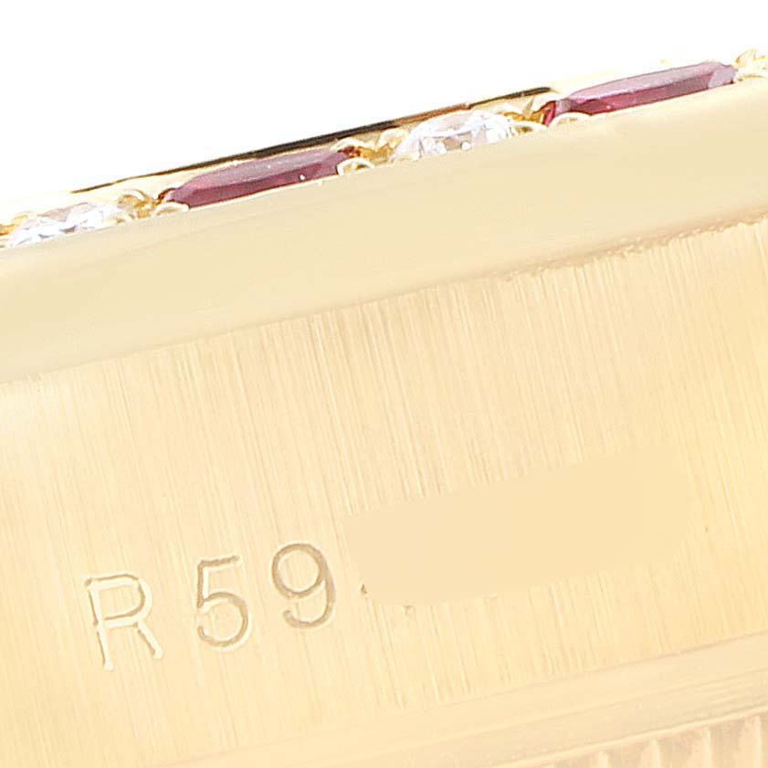 The image shows a close-up of the bezel and side of a Rolex President 69188 Women's Yellow Gold Champagne Dial 69188 Women's Yellow Gold Champagne Dial model watch, with part of the serial number visible.