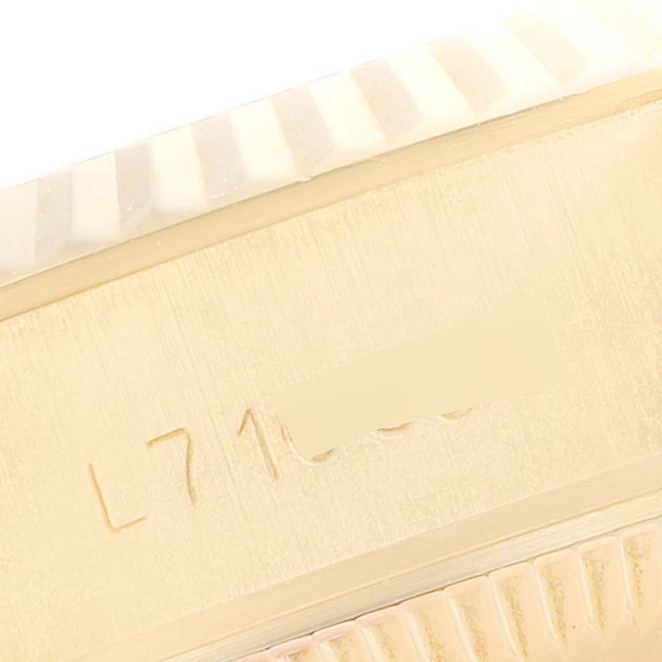 This image shows a close-up of the serial number engraving on the side of a Rolex President 69178 Women's Yellow Gold Champagne Dial 69178 Women's Yellow Gold Champagne Dial model watch.