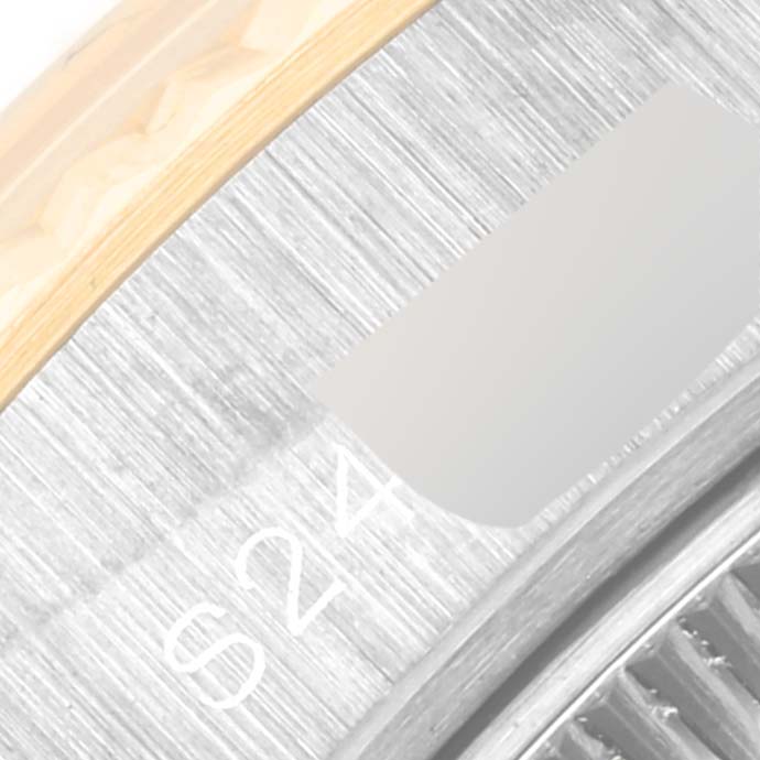 This close-up image of a Rolex President 69179 Women's White Gold Mother of Pearl Dial 69179 Women's White Gold Mother of Pearl Dial model shows part of the bezel and digits on the inner ring.