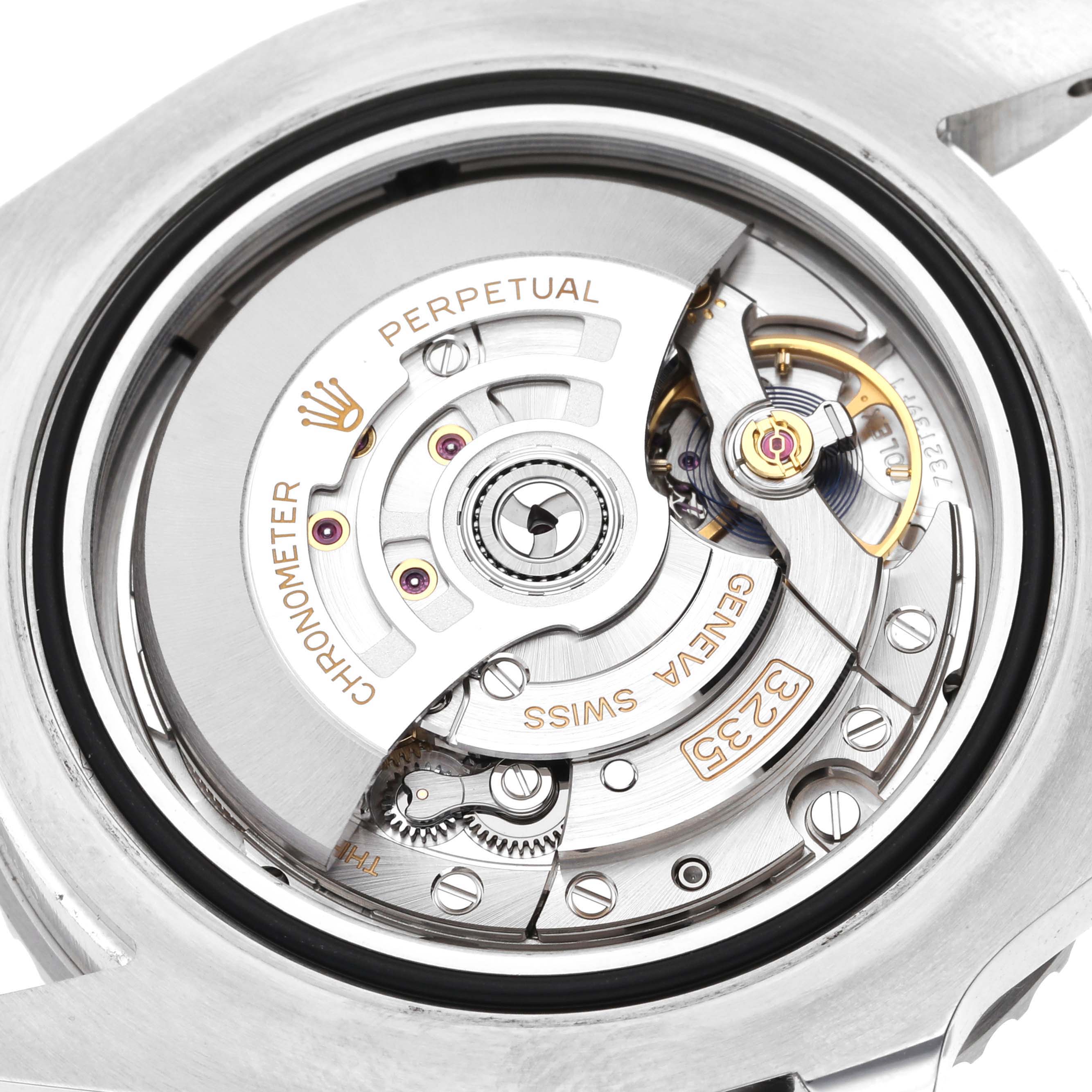 The image shows the intricate movement mechanism of a Rolex Sea-Dweller 126600 Men
s Stainless Steel Black Dial 126600 Men
s Stainless Steel Black Dial watch from a close-up, angled view of its back.