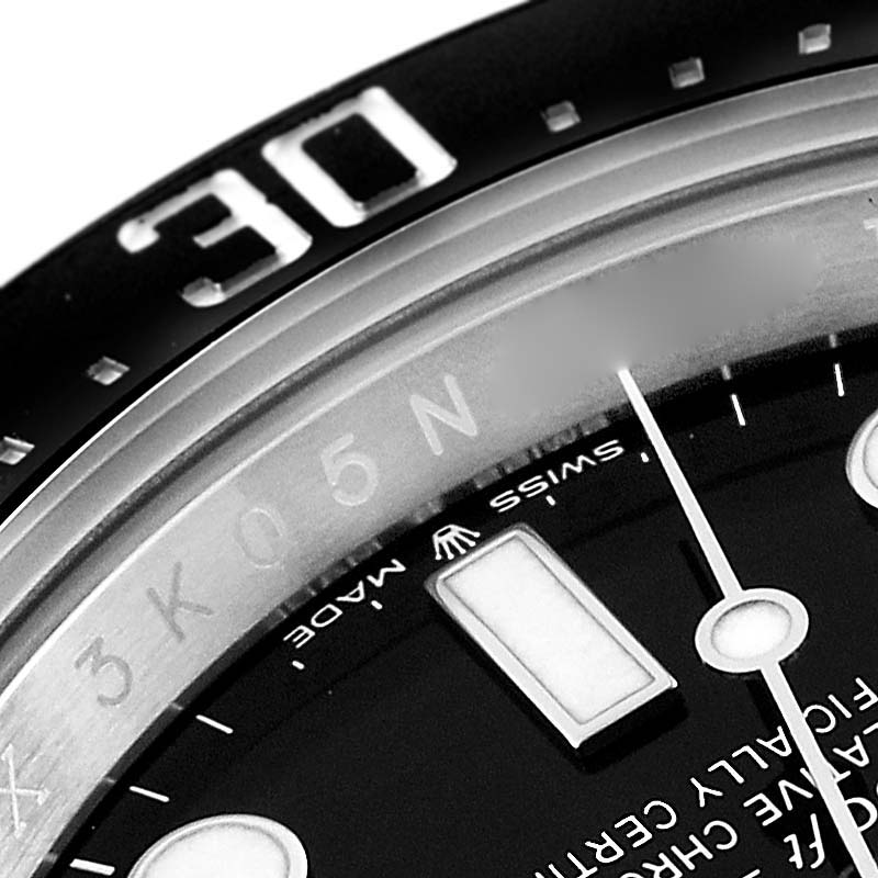The image shows a close-up of the dial and bezel, specifically the 30-minute marker, of a Rolex Sea-Dweller 126600 Men
s Stainless Steel Black Dial 126600 Men
s Stainless Steel Black Dial watch.
