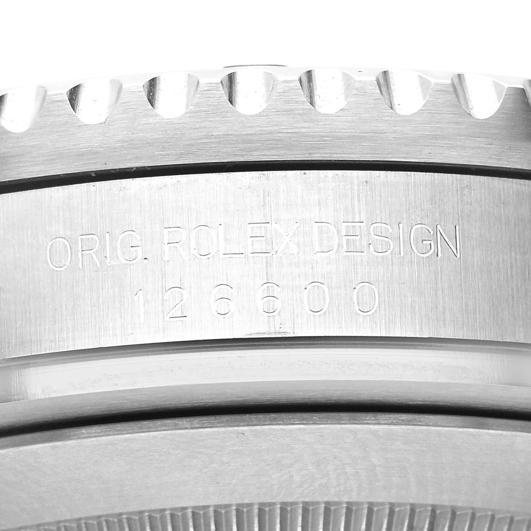 This close-up image shows the side of the Rolex Sea-Dweller 126600 Men
s Stainless Steel Black Dial 126600 Men
s Stainless Steel Black Dial
s case with the model number "126600" and the text "Orig. Rolex Design."