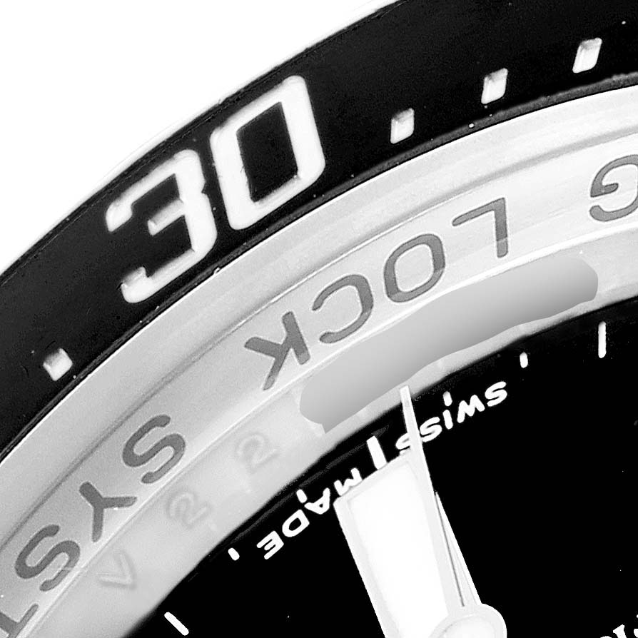 The image shows a close-up of the bezel, part of the dial, and the "Ring Lock" text of the Rolex Sea-Dweller 116660 Men
s Stainless Steel Black Dial 116660 Men
s Stainless Steel Black Dial watch.
